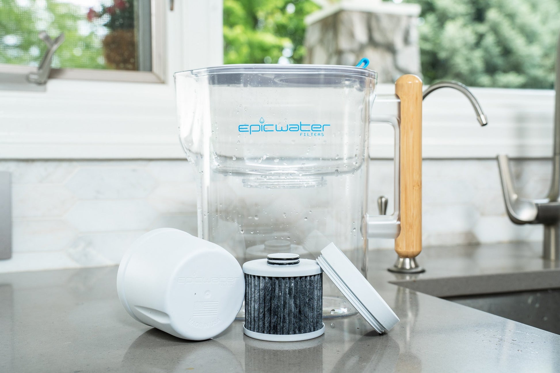 Red Epic Water Filters Pure XP pitcher with red lid, designed to reduce fluoride, PFAS, and parasites from drinking water.