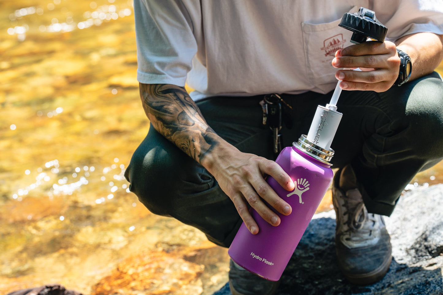 Epic Water Filters The Answer 2.0 reusable water filter compatible with Hydro Flask and Nalgene bottles, shown in a close-up image.