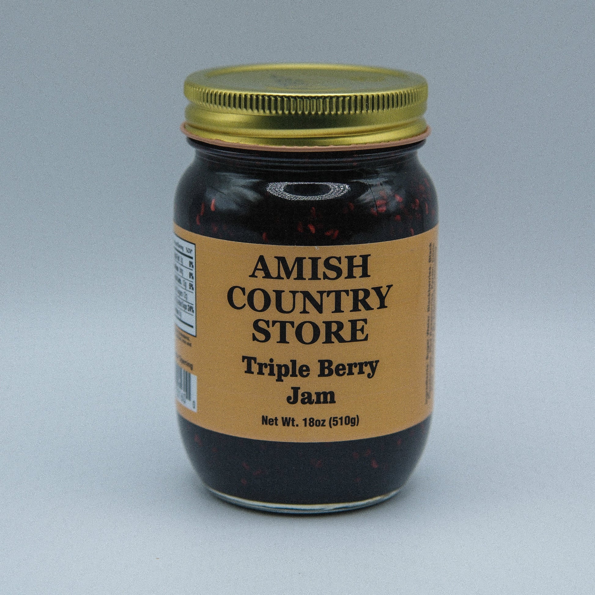 Amish Country Store triple berry jam in an 18oz jar, canned goods with fresh berry filling and fruit chunks.