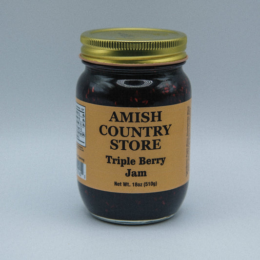 Amish Country Store triple berry jam in an 18oz jar, canned goods with fresh berry filling and fruit chunks.