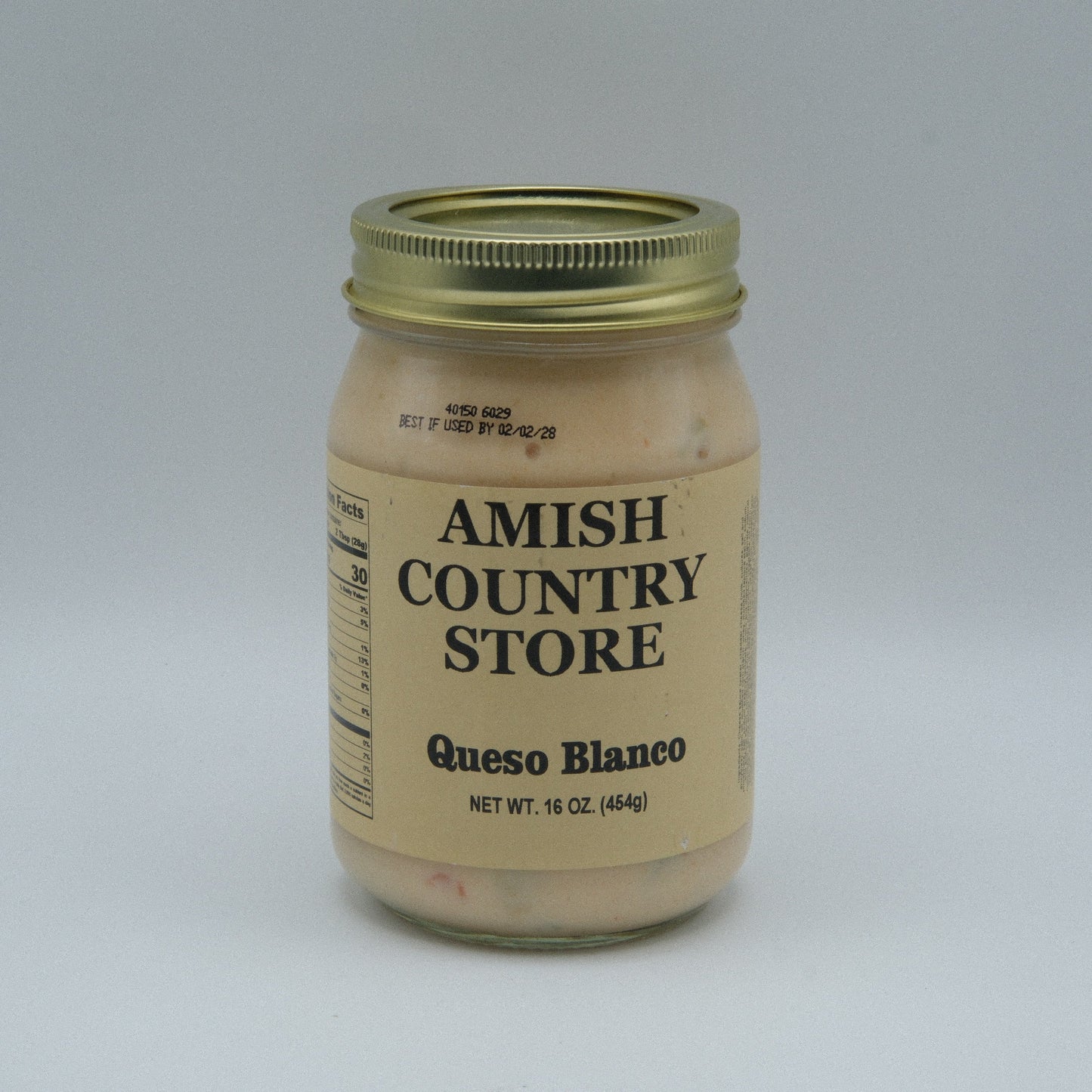 Canned Amish Country Store Queso Blanco in 16 oz can, creamy white cheese product in a sealed metal container.