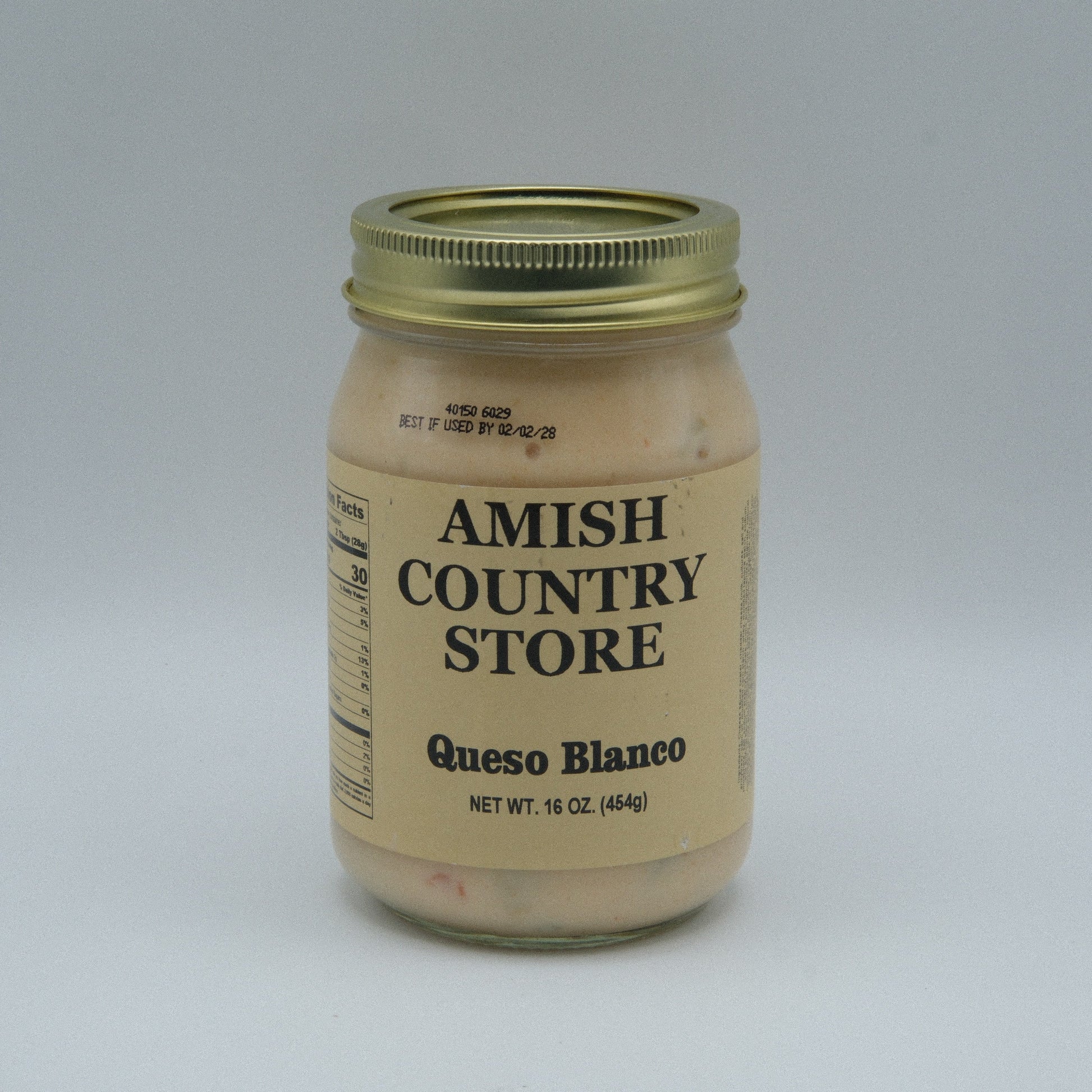 Canned Amish Country Store Queso Blanco in 16 oz can, creamy white cheese product in a sealed metal container.