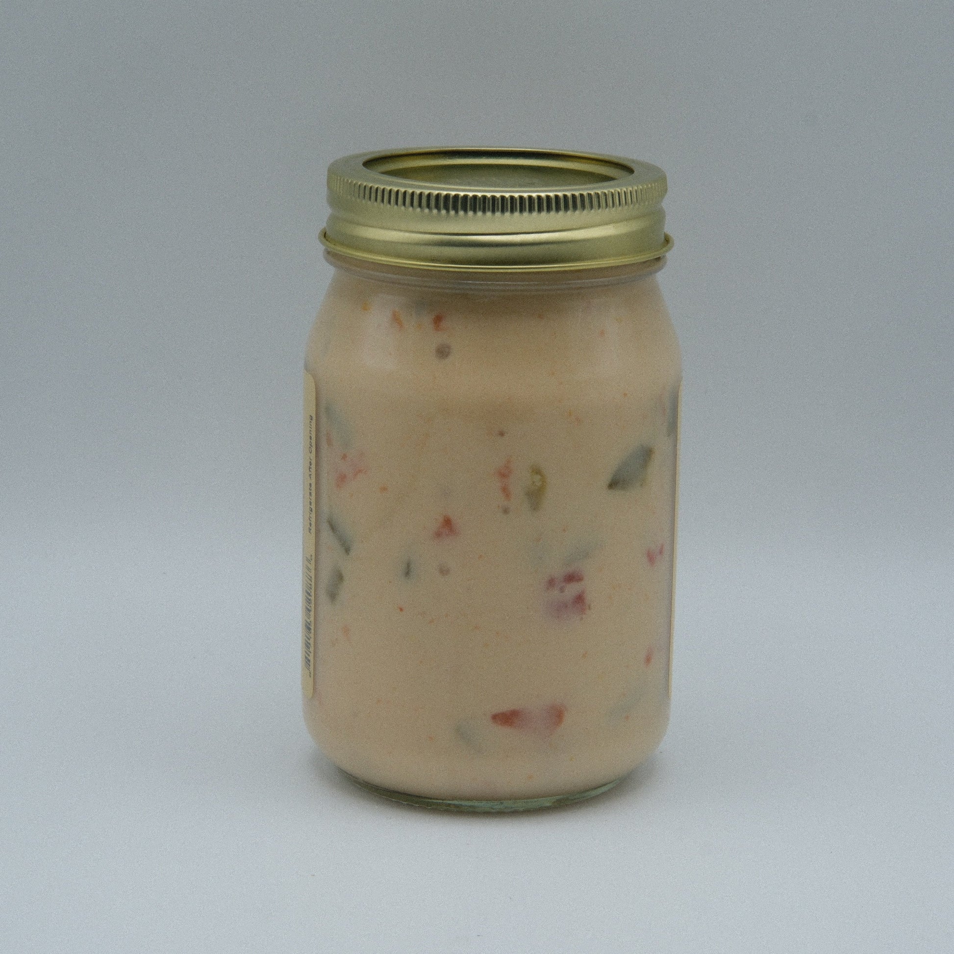 Canned Amish Country Store Queso Blanco cheese in 16 oz can, creamy white cheese with smooth texture and label visible.