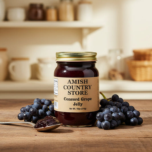 Canned Amish Country Store Concord Grape Jelly jar with purple jelly visible, 18 oz size, stored on a kitchen shelf.