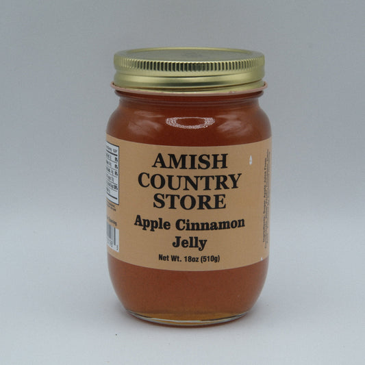 Canned Amish Country Store apple cinnamon jelly jar with a label, showcasing the homemade fruit spread in a glass jar.