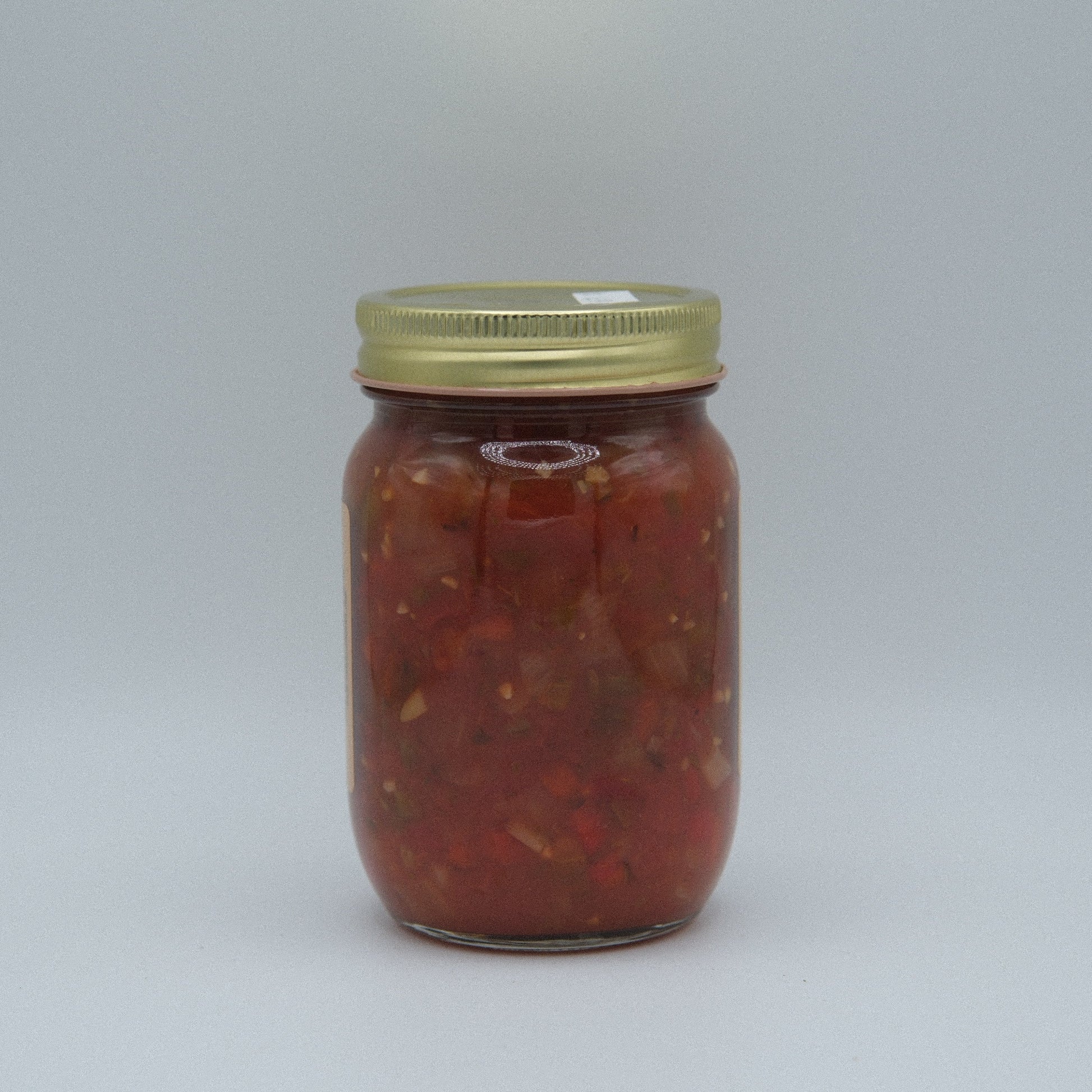Canned Amish Country Store Medium Salsa in a 14.5 oz jar, showcasing fresh vegetables and tomatoes in a vibrant salsa.