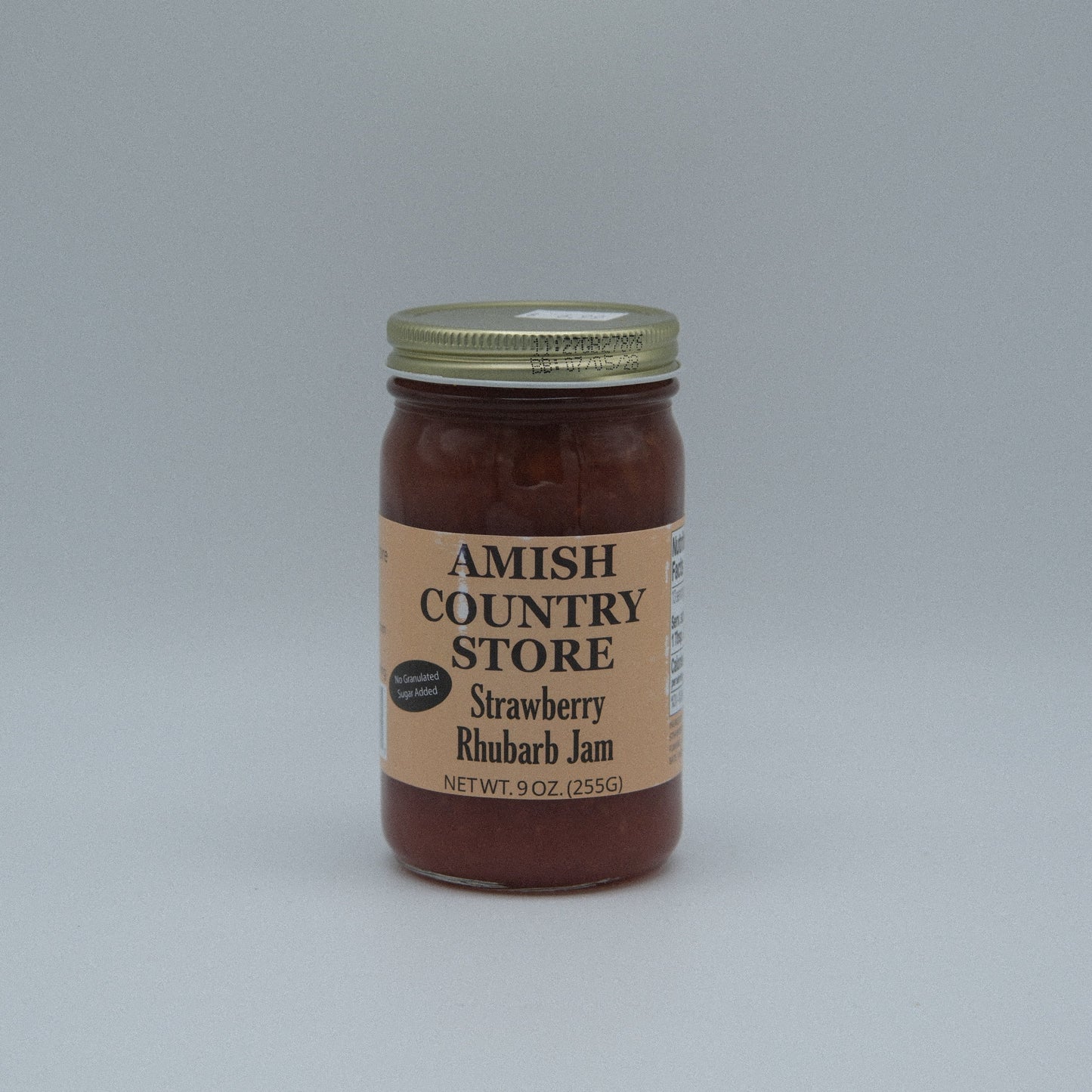 Canned Strawberry Rhubarb Jam in 8 oz jar from Amish Country Store, no sugar added, with fresh strawberries and rhubarb visible.