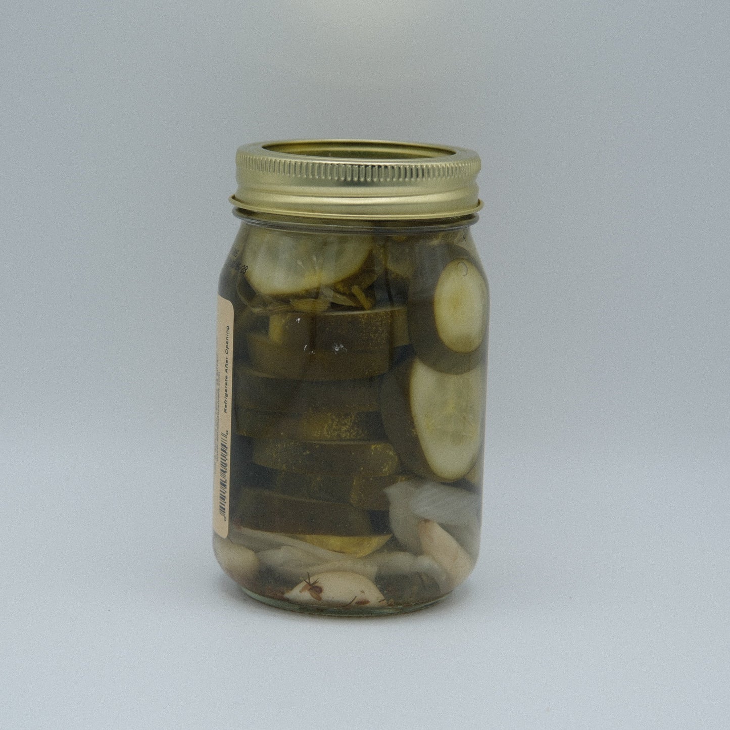 Canned Amish Country Store What'cha Dill Pickles Coin Cut 16 oz jar with bright label and dill pickle slices visible inside.
