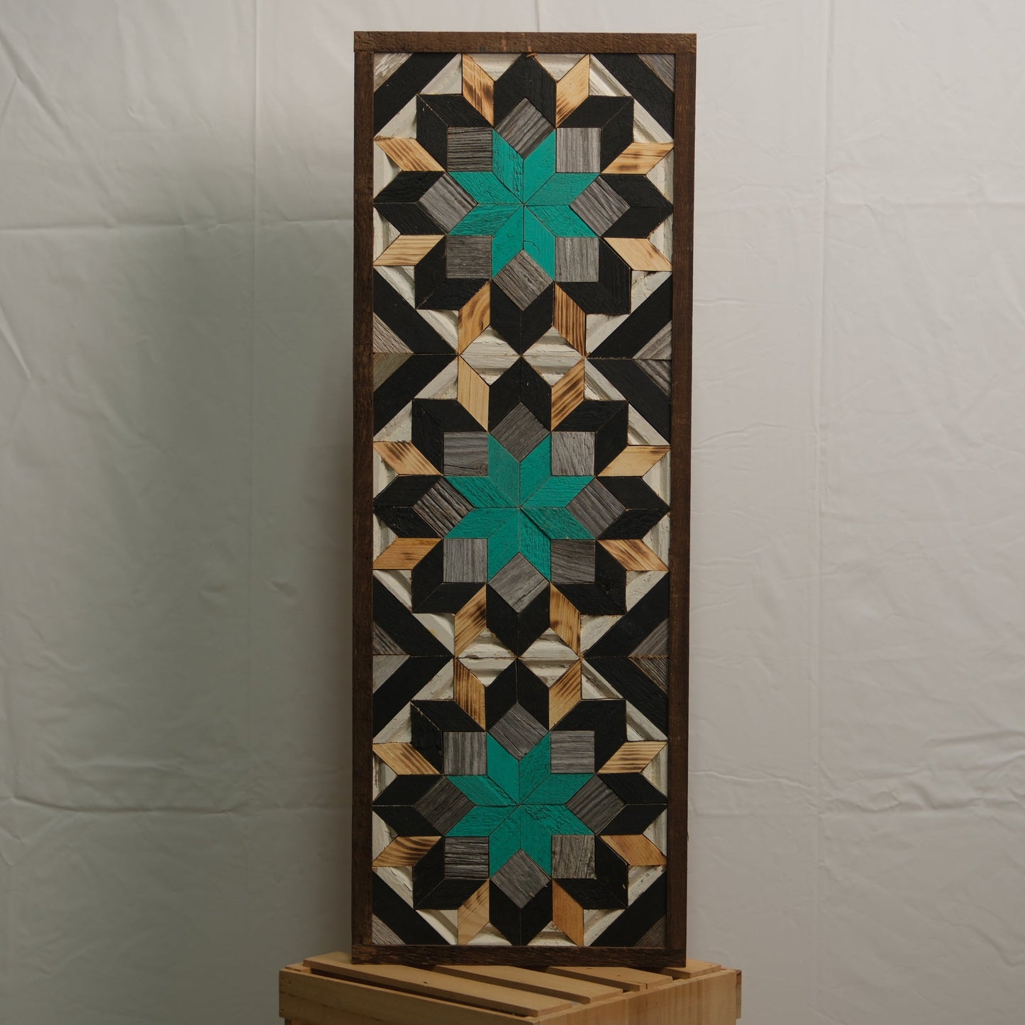 Amish handmade barn quilt banner in traditional design, measuring 10.5 x 30 inches, displayed on a rustic barn wall.