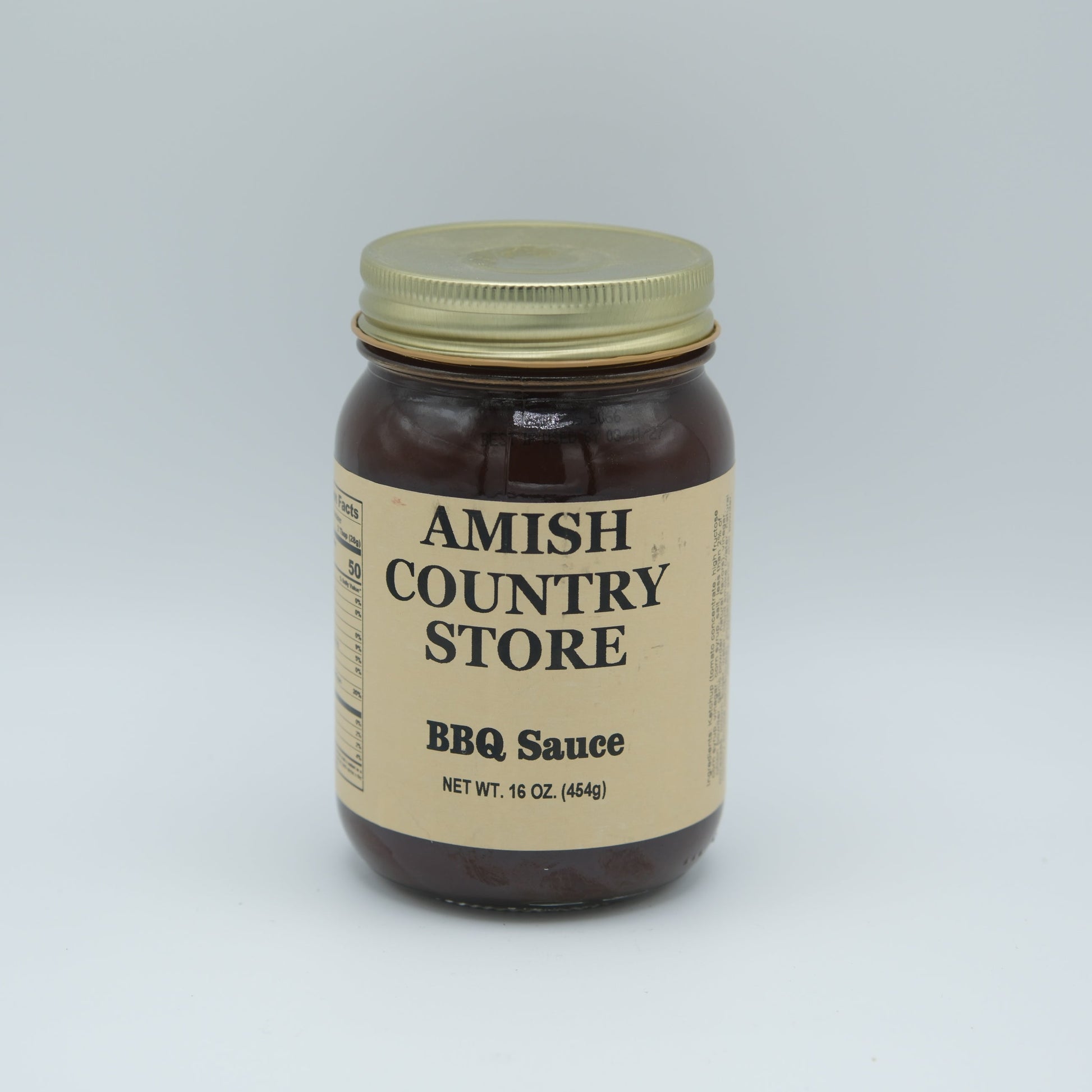 Canned Amish Country Store BBQ Sauce 16 oz jar, featuring a label with smoky flavor and rich tomato base.