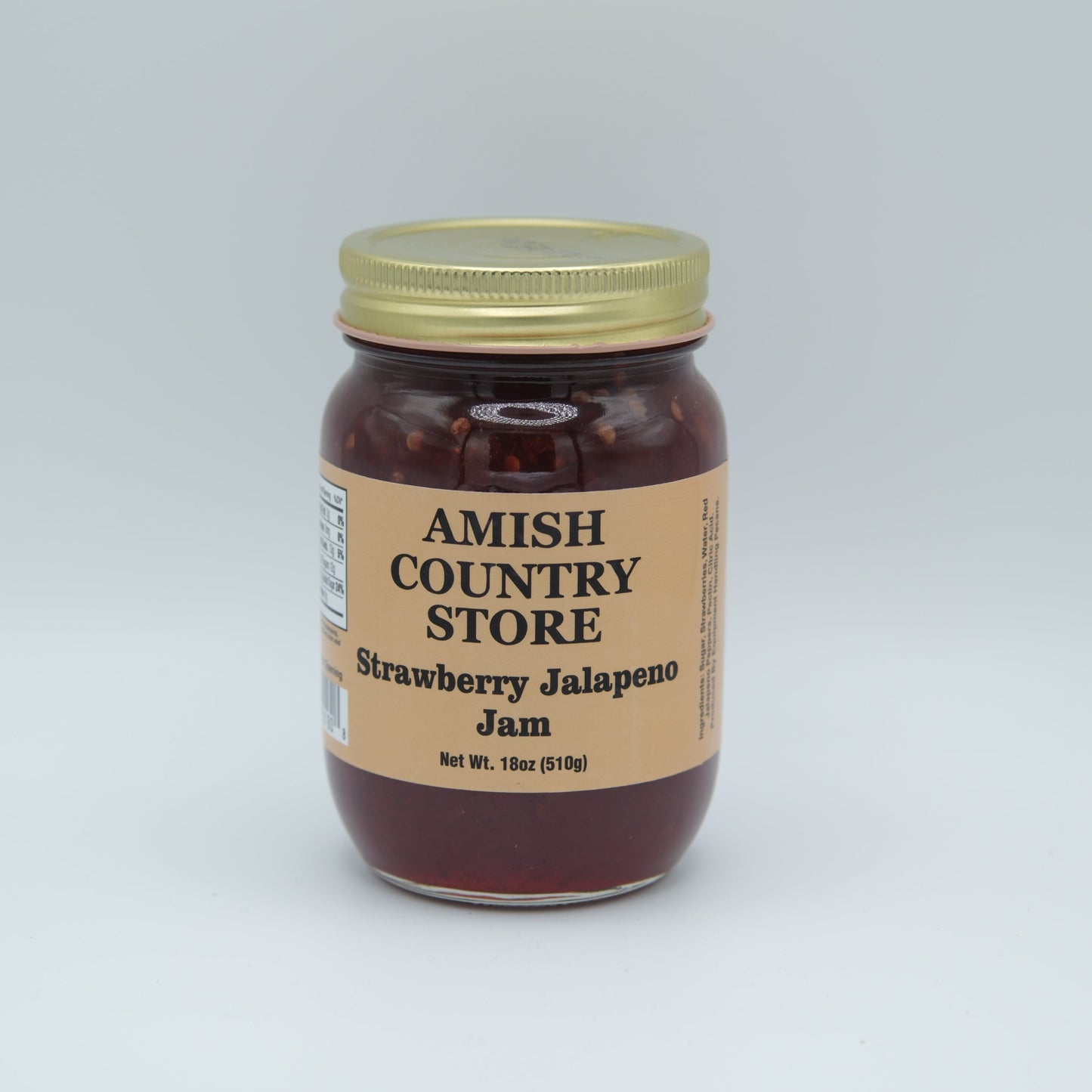 Amish Country Store strawberry jalapeno jam in 18oz canned jar with fresh strawberries and jalapenos visible.