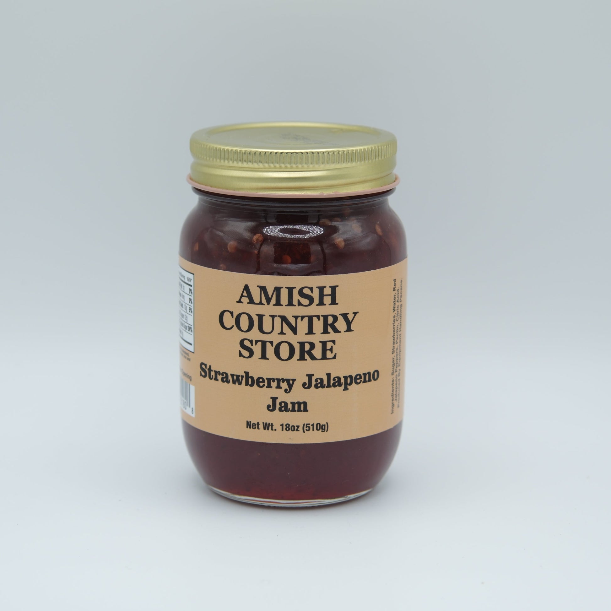 Amish Country Store strawberry jalapeno jam in 18oz canned jar with fresh strawberries and jalapenos visible.
