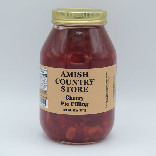 Sweet Amish Country Store cherry pie filling in a jar, with visible cherries and syrup, ready for baking or dessert.