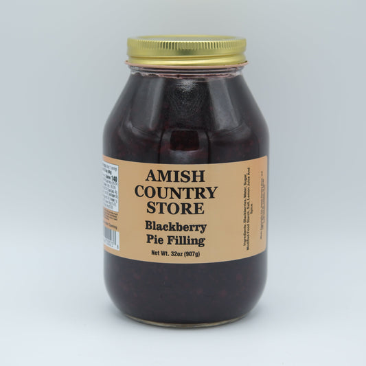 Amish Country Store Blackberry Pie Filling jar with label, showing rich dark blackberries and fruit filling inside.