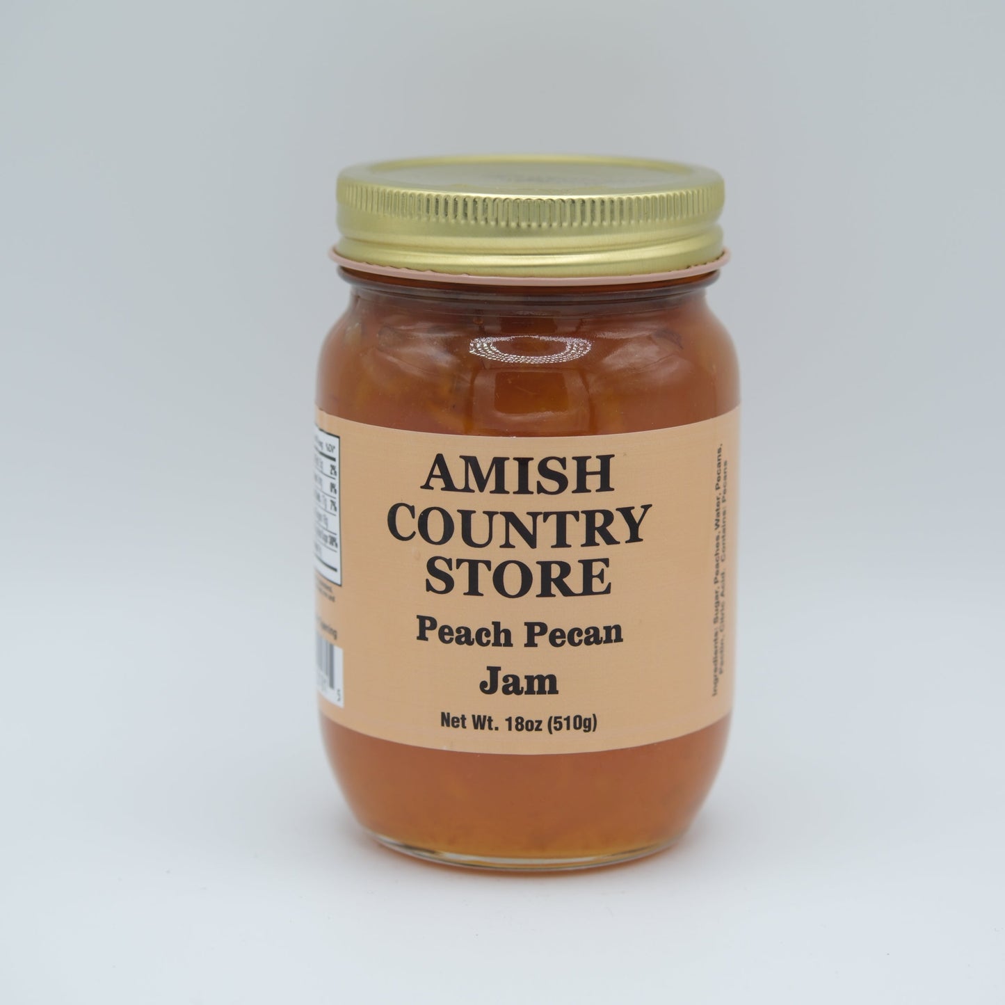 Amish Country Store peach pecan jam in an 18oz jar, showcasing the canned goods with peach and pecan ingredients visible.