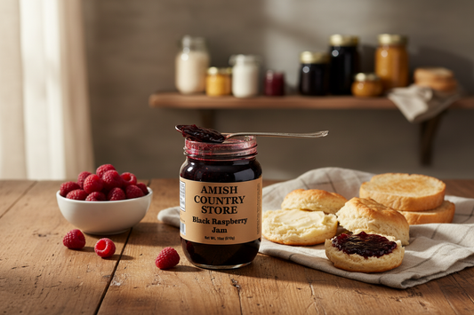 Canned Amish Country Store Black Raspberry Jam in an 18 oz jar, showcasing glossy black raspberry spread with a metal lid.