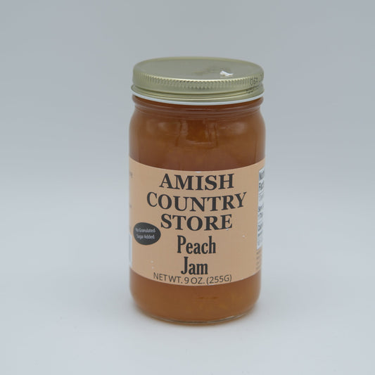 Canned peach jam in an 8 oz jar with no added sugar from Amish Country Store, featuring fresh peaches and a smooth texture.