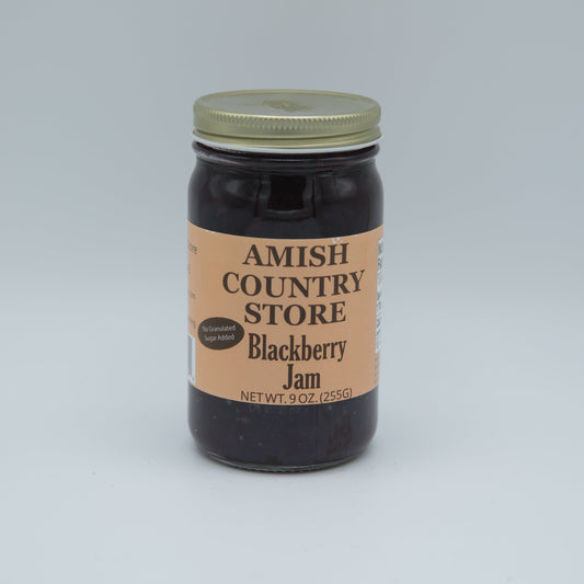 Amish Country Store blackberry jam in 8 oz can, no sugar added, smooth blackberries in glass jar.
