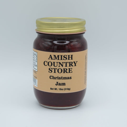 Canned Christmas jam from Amish Country Store, showcasing a jar with festive holiday label and colorful jam inside.