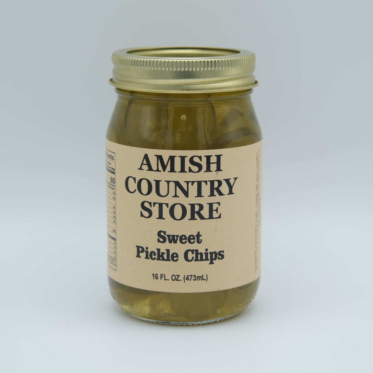 Canned sweet pickle chips in a 16 oz jar from Amish Country Store, showing glossy, sliced sweet pickles ready for use.