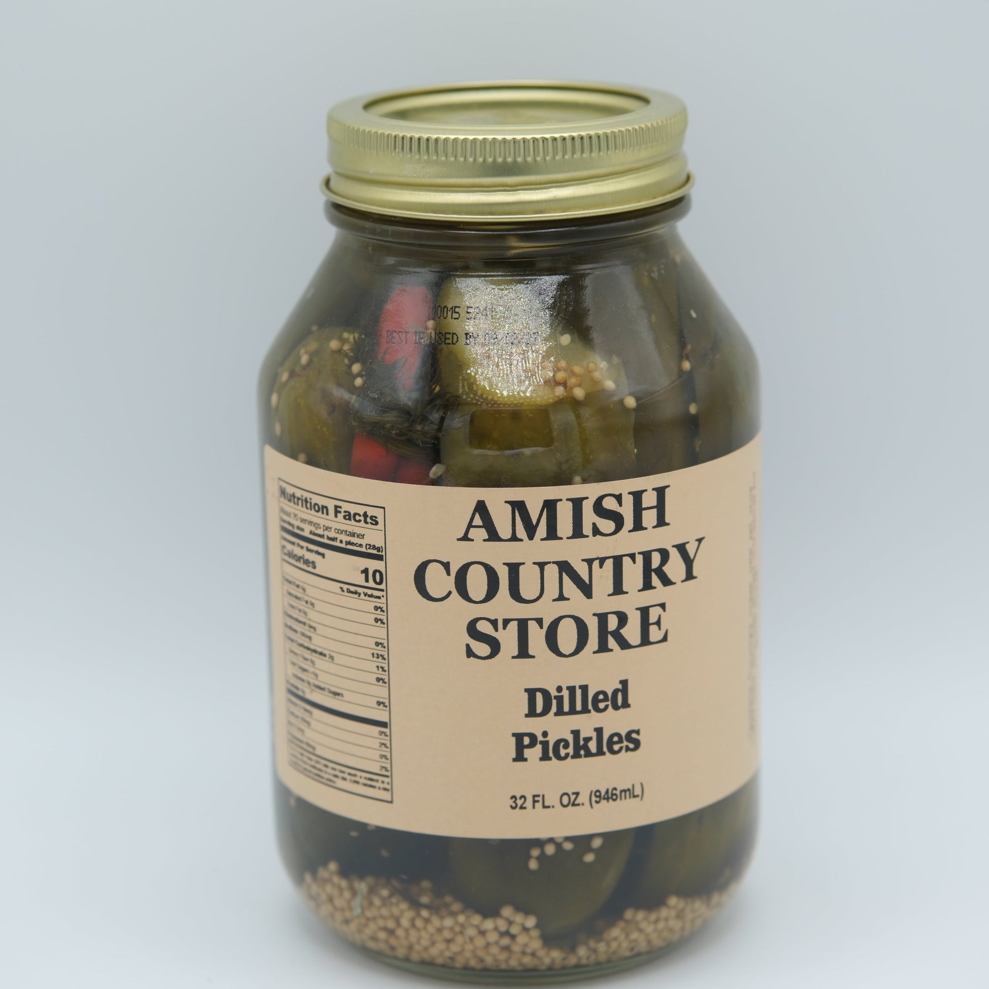 Canned Amish Country Store Dilled Pickles in 32 oz jar with crunchy dill slices and fresh herbs.