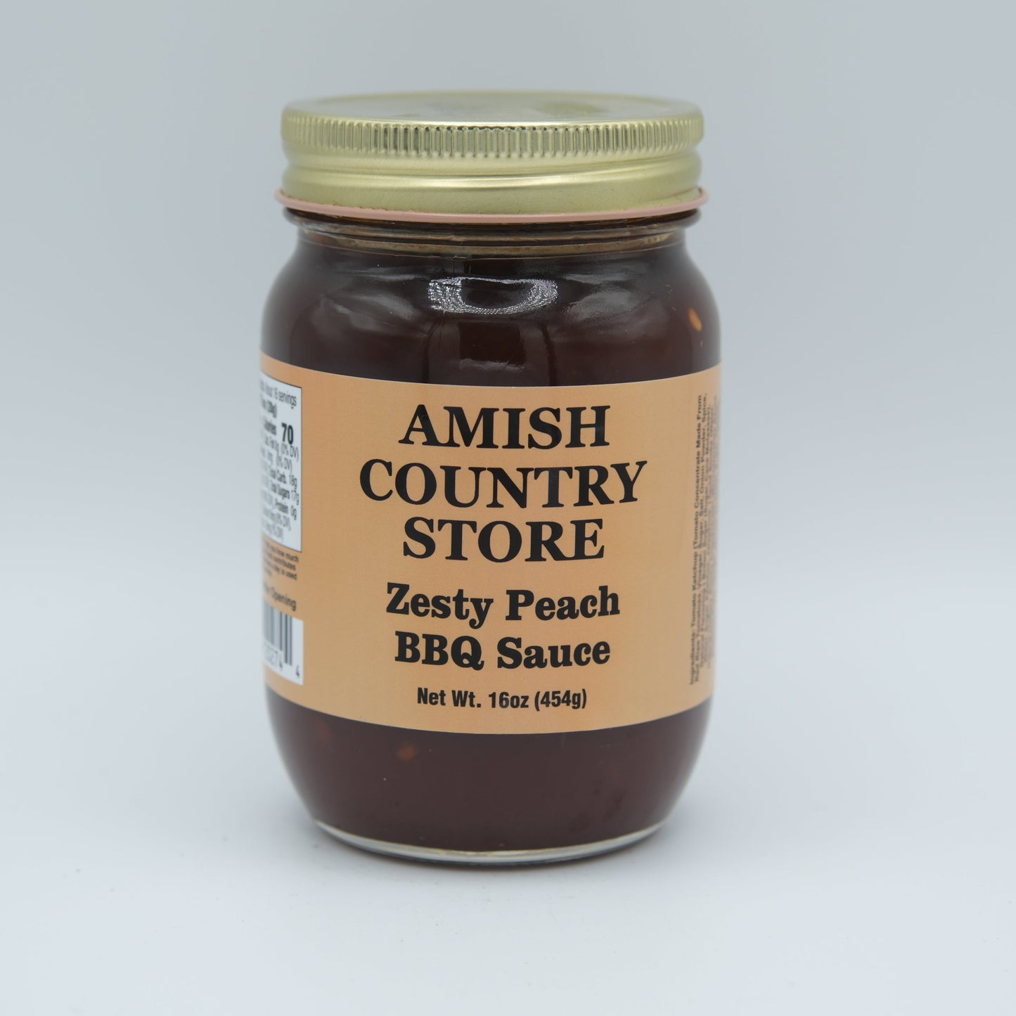 Canned Zesty Peach BBQ Sauce by Amish Country Store in a 16 oz jar, showcasing fresh peaches and rich barbecue flavor.