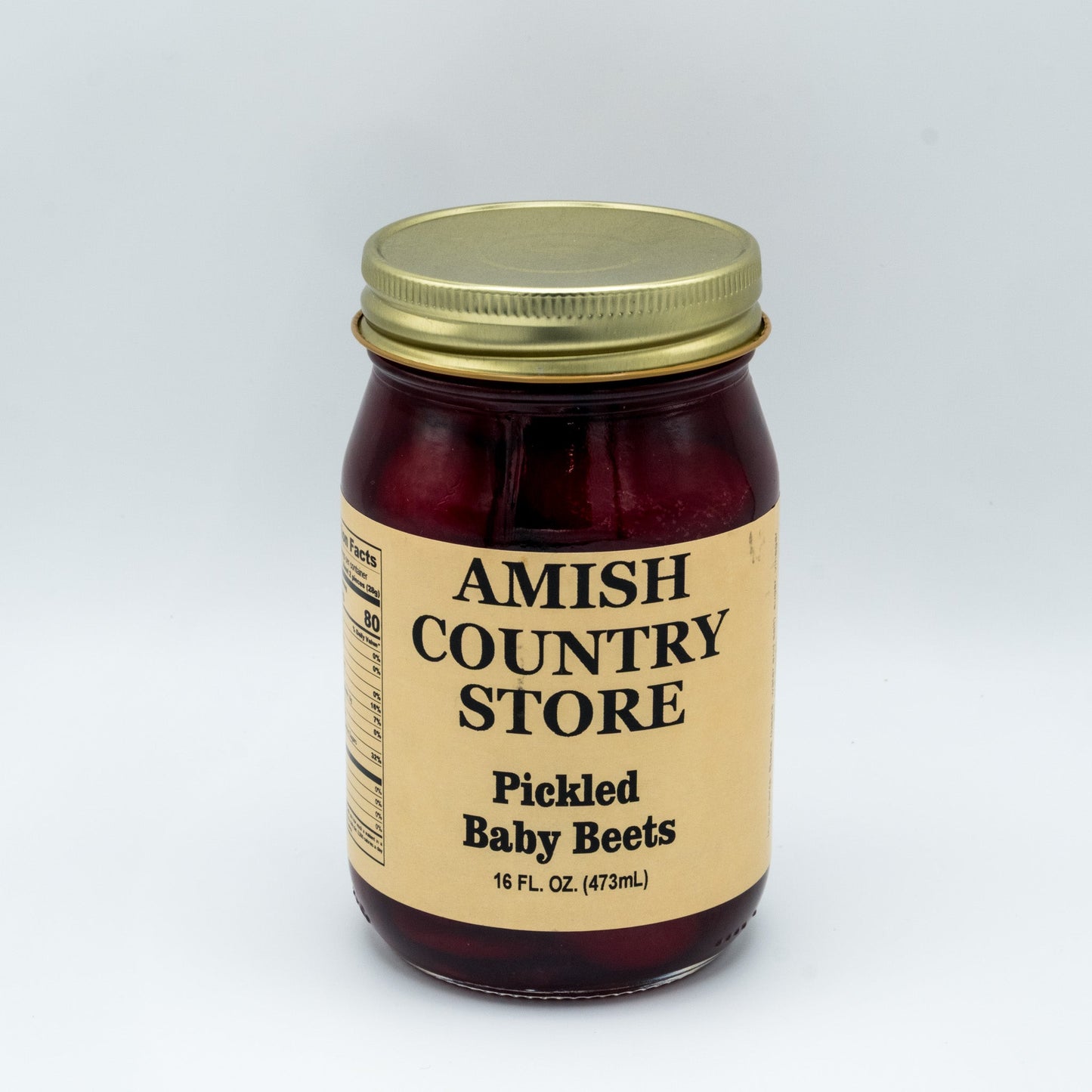 Canned Amish Country Store pickled baby beets in a 32oz jar, showing vibrant red beets submerged in pickling liquid.