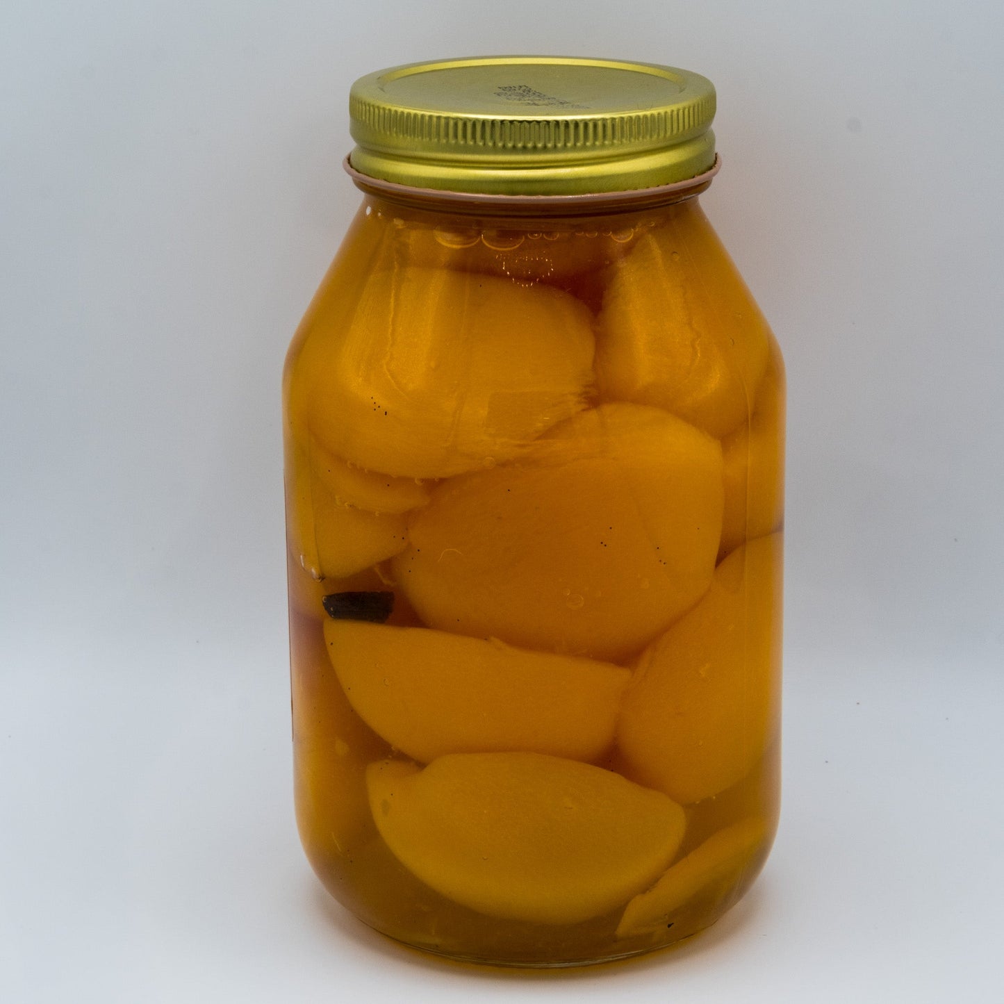 Canned vanilla peaches in syrup with real vanilla beans in a 32oz jar from Amish Country Store.