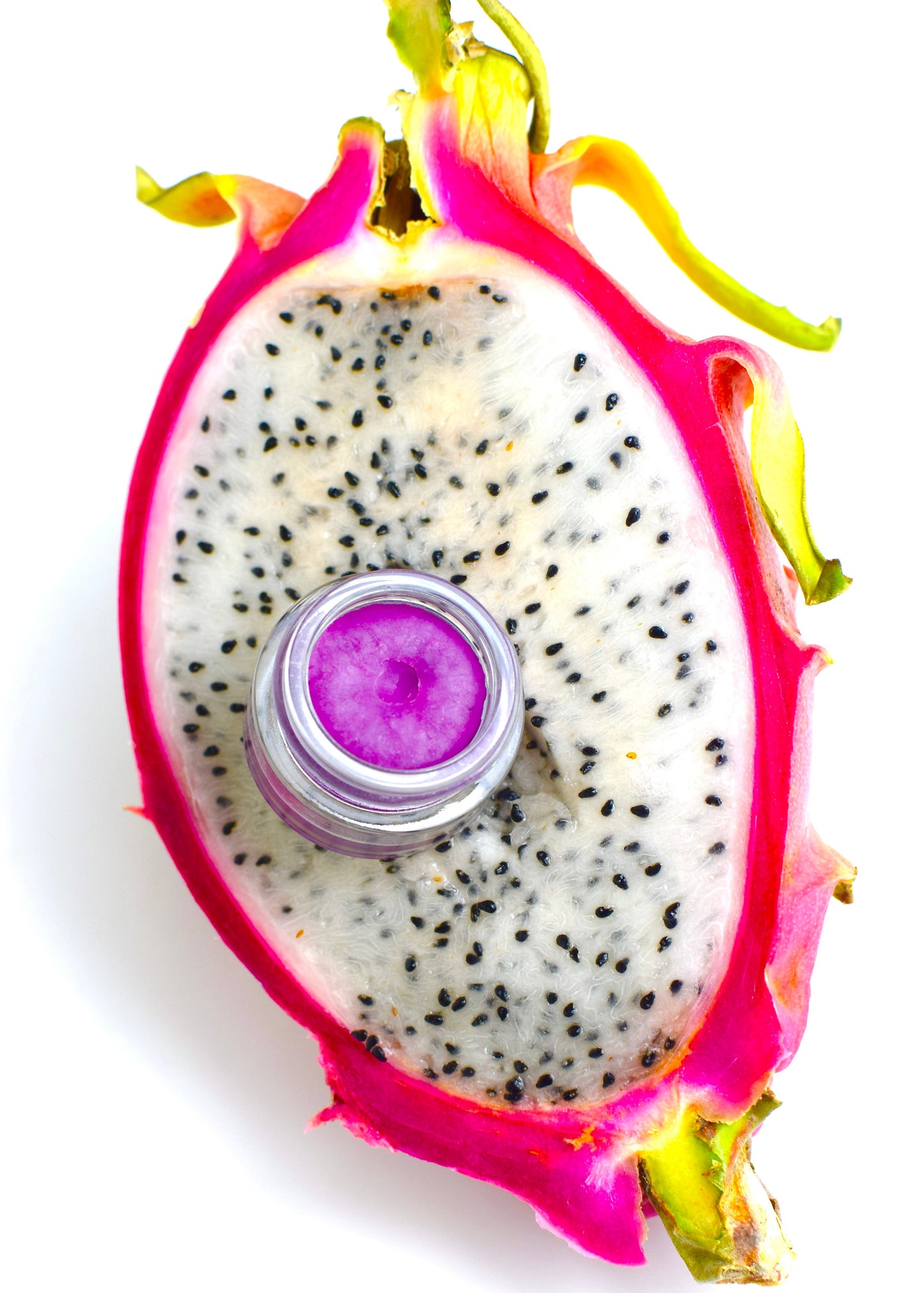 Dragon Fruit Lip Gloss by Plant Makeup displayed in a sleek tube with vibrant pink and purple hues, set against a neutral background.