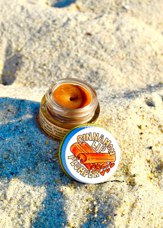Plant Makeup Cinnamon Lip Plumper in natural light, showing glossy, plump lips with a hint of cinnamon color.