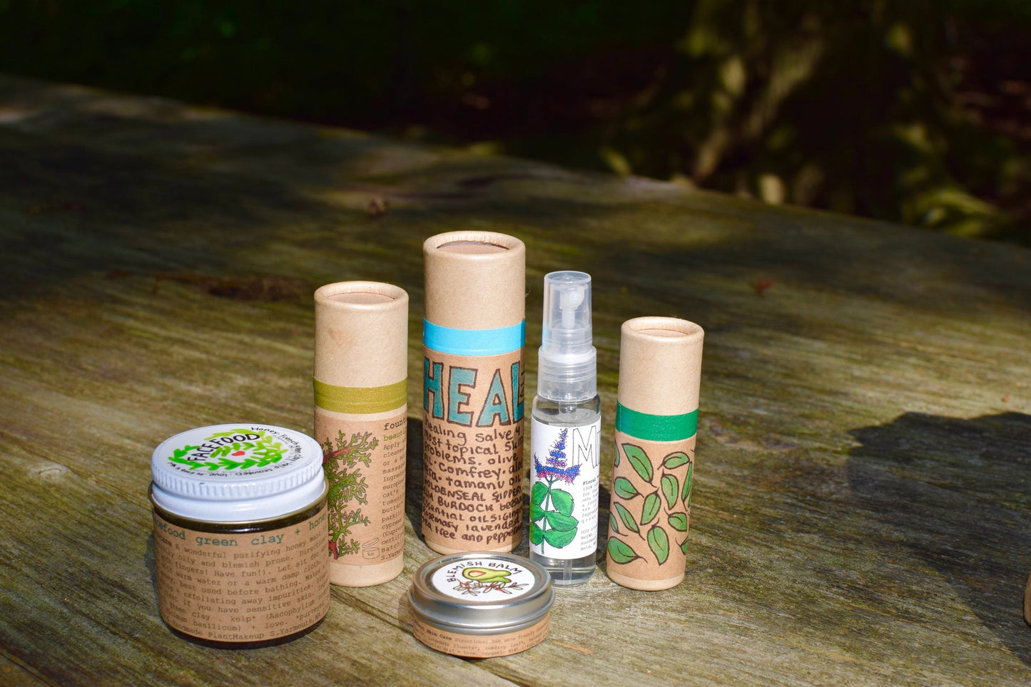 Plant Makeup Heal All Balm jar with label, natural skincare product for soothing and healing skin, close-up shot.