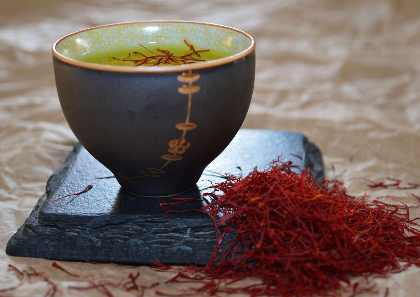 Premium Super Negin saffron threads from Vanilla Bean Kings, showcasing vibrant red saffron strands on a white background.
