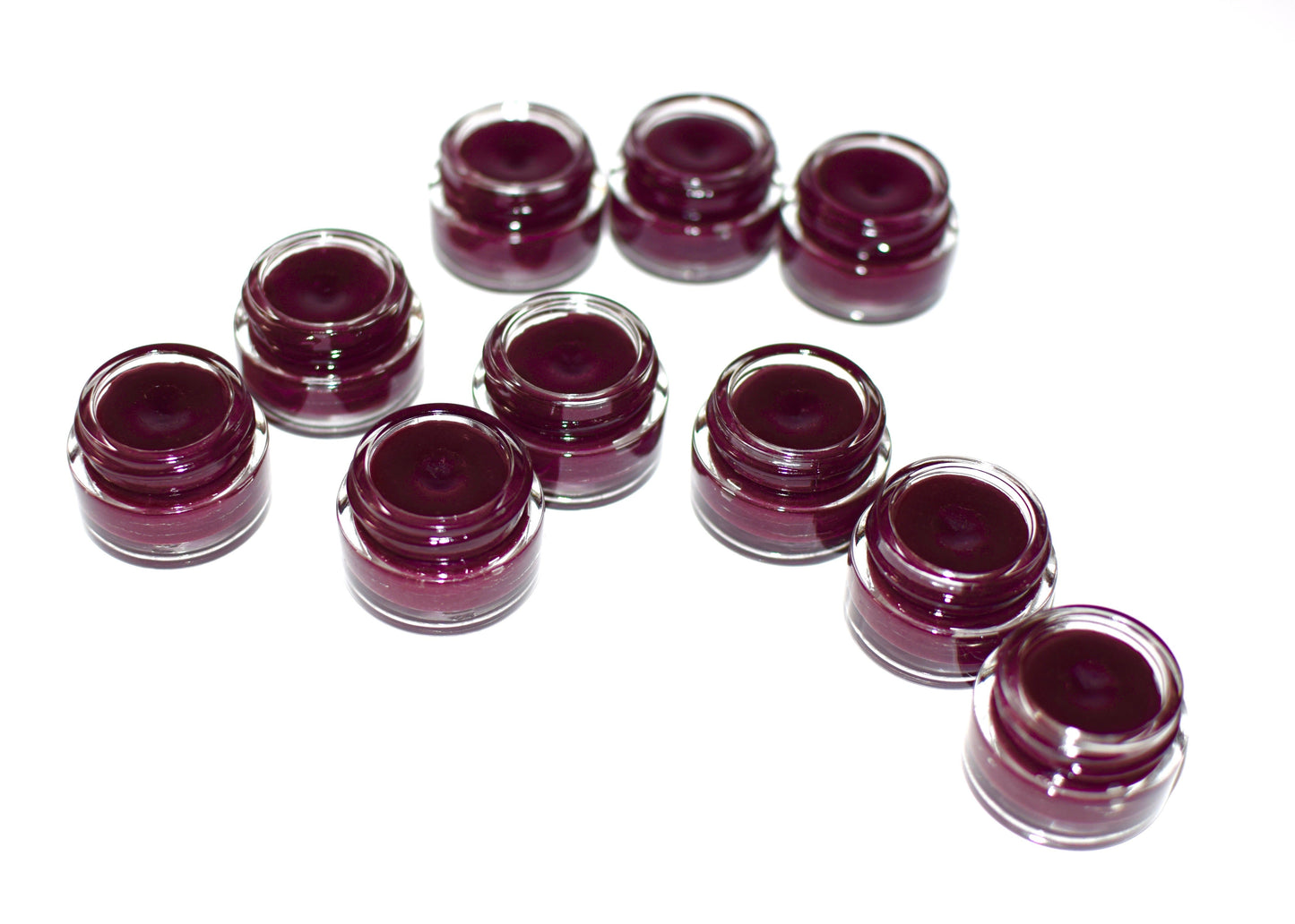 Plant Makeup Hibiscus and Beet Lip Tint in a sleek tube, showing vibrant pink and red shades for natural lip color enhancement.