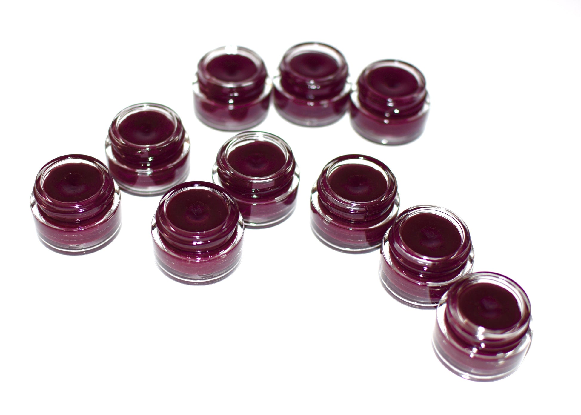 Plant Makeup Hibiscus and Beet Lip Tint in a sleek tube, showing vibrant pink and red shades for natural lip color enhancement.