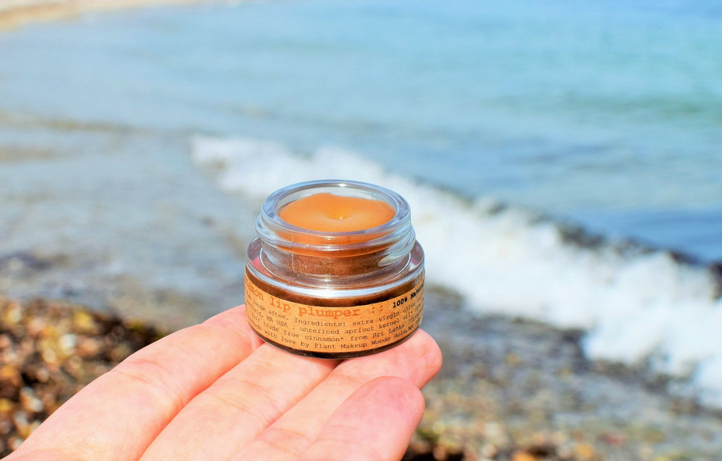 Plant Makeup Cinnamon Lip Plumper applying natural cinnamon-infused formula to enhance lip fullness and color.