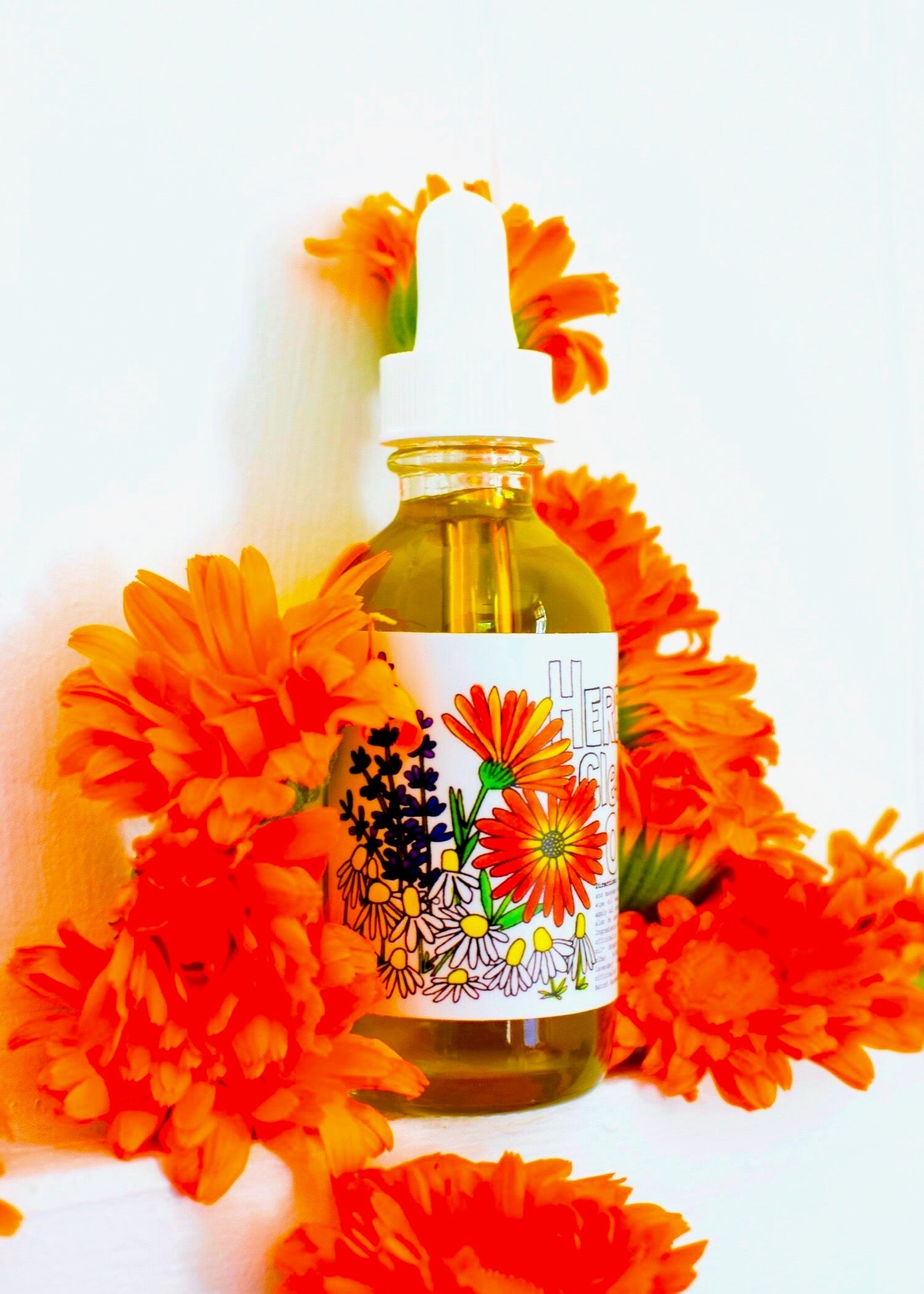 Herbal cleansing oil by plant makeup shown in a clear bottle with fresh herbs, ideal for gentle skincare and makeup removal.