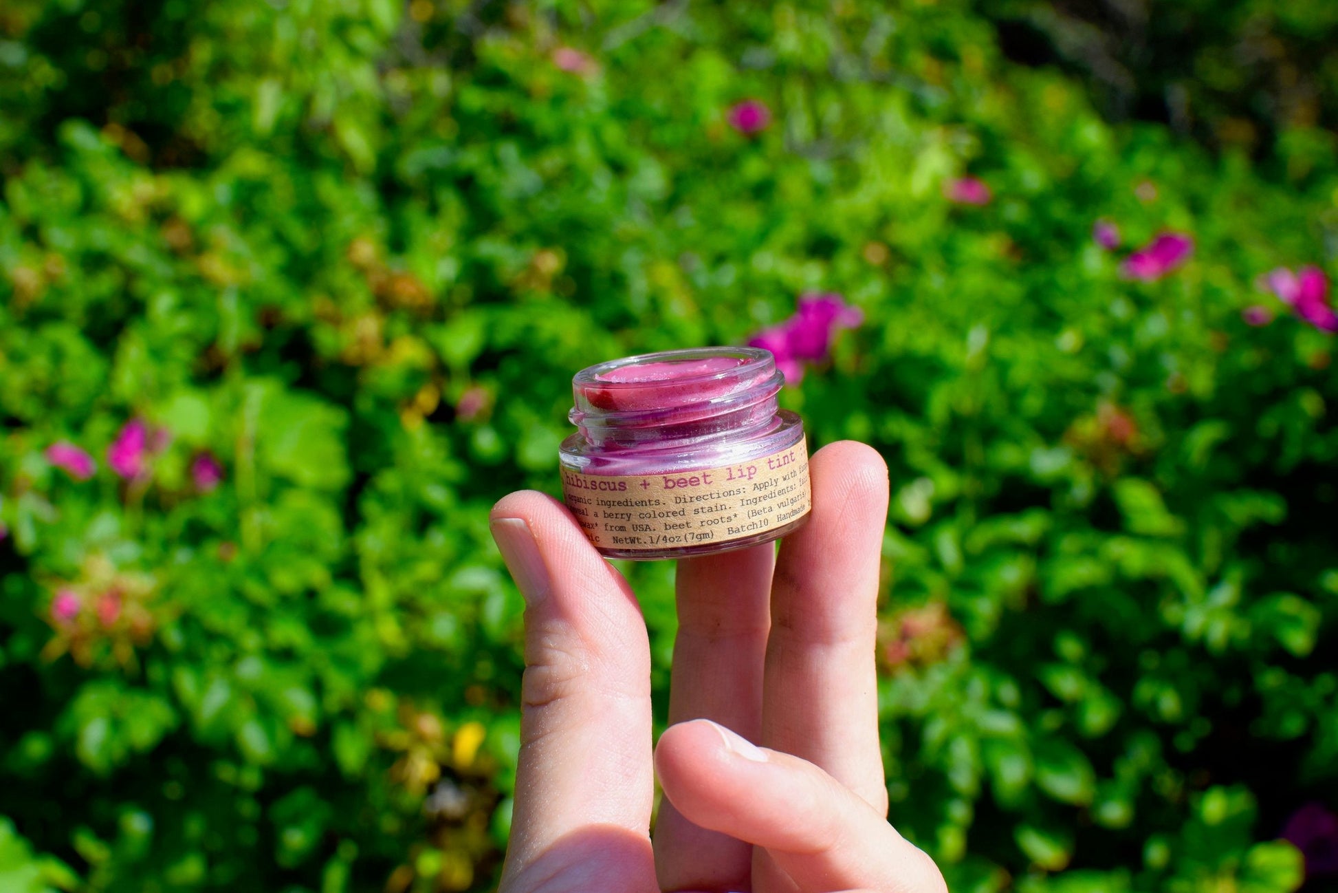 Plant Makeup Hibiscus and Beet Lip Tint in a tube, showing vibrant pink and red shades for natural, colorful lip color.