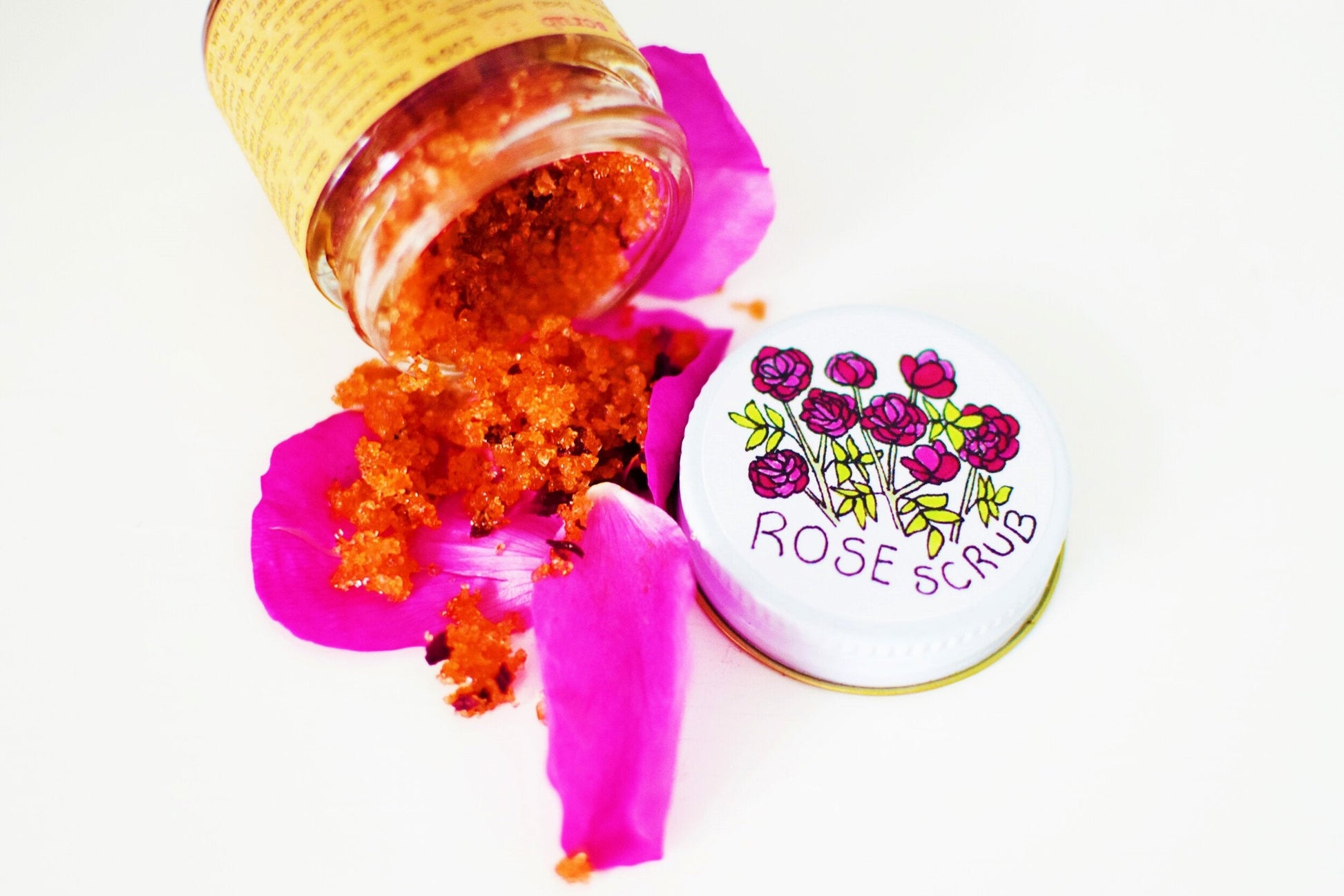 Plant Makeup Beach Rose Scrub in a jar with natural rose petals, showing the exfoliating scrub texture and floral packaging.