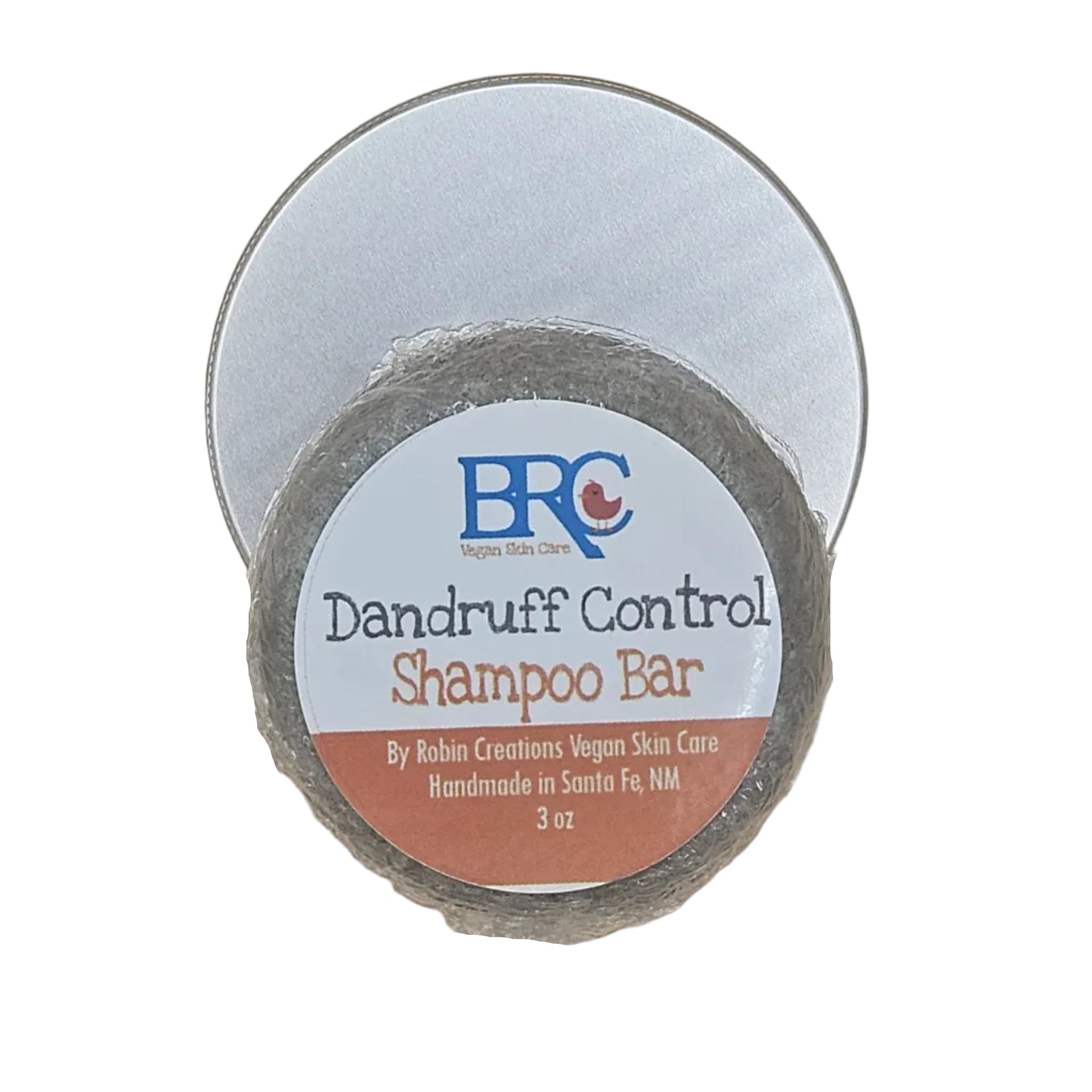 By Robin Creations sulfate-free dandruff shampoo bar in a tin, showcasing its natural, handcrafted design and packaging.