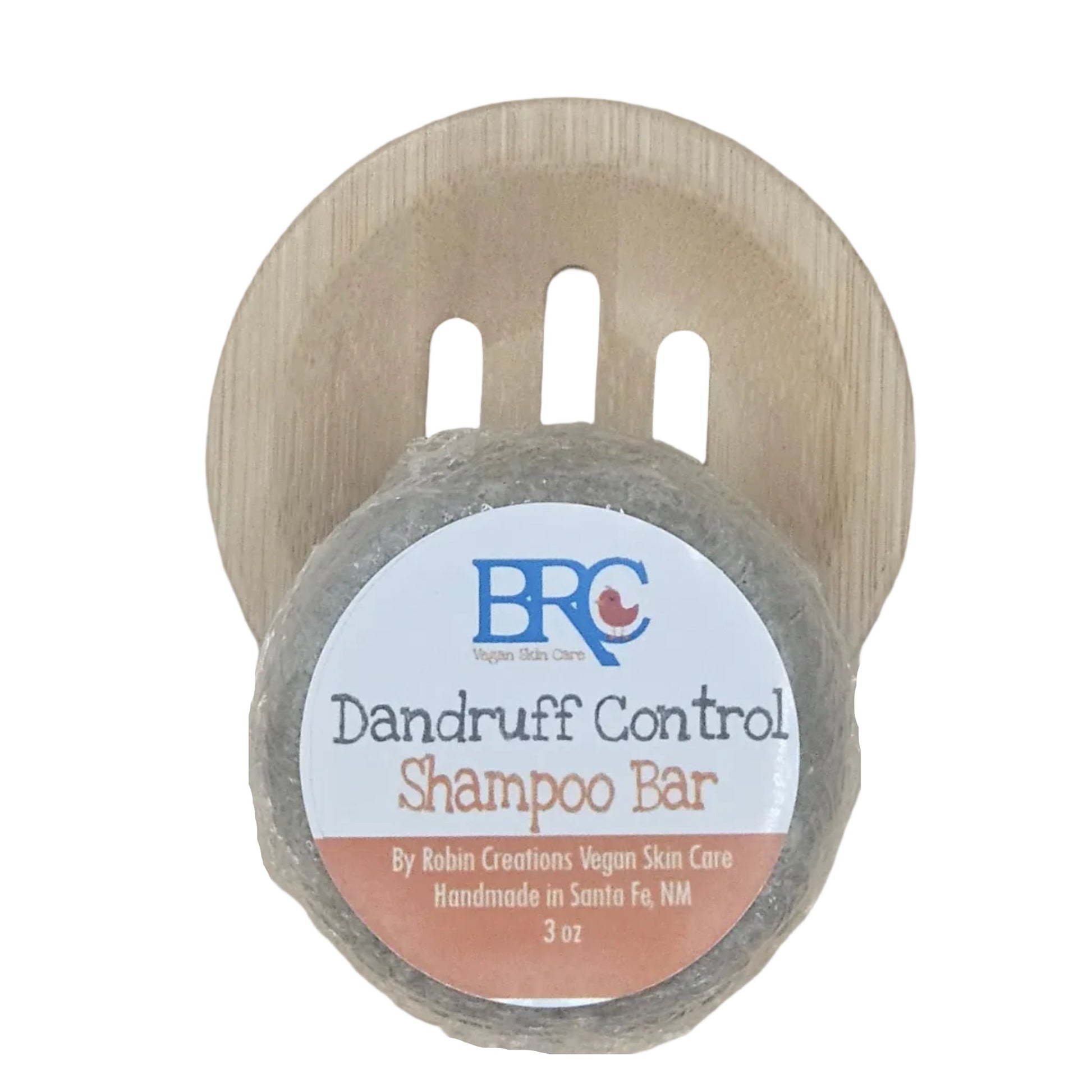 Handcrafted sulfate-free dandruff shampoo bar by By Robin Creations shown on a tray, with natural ingredients and packaging.