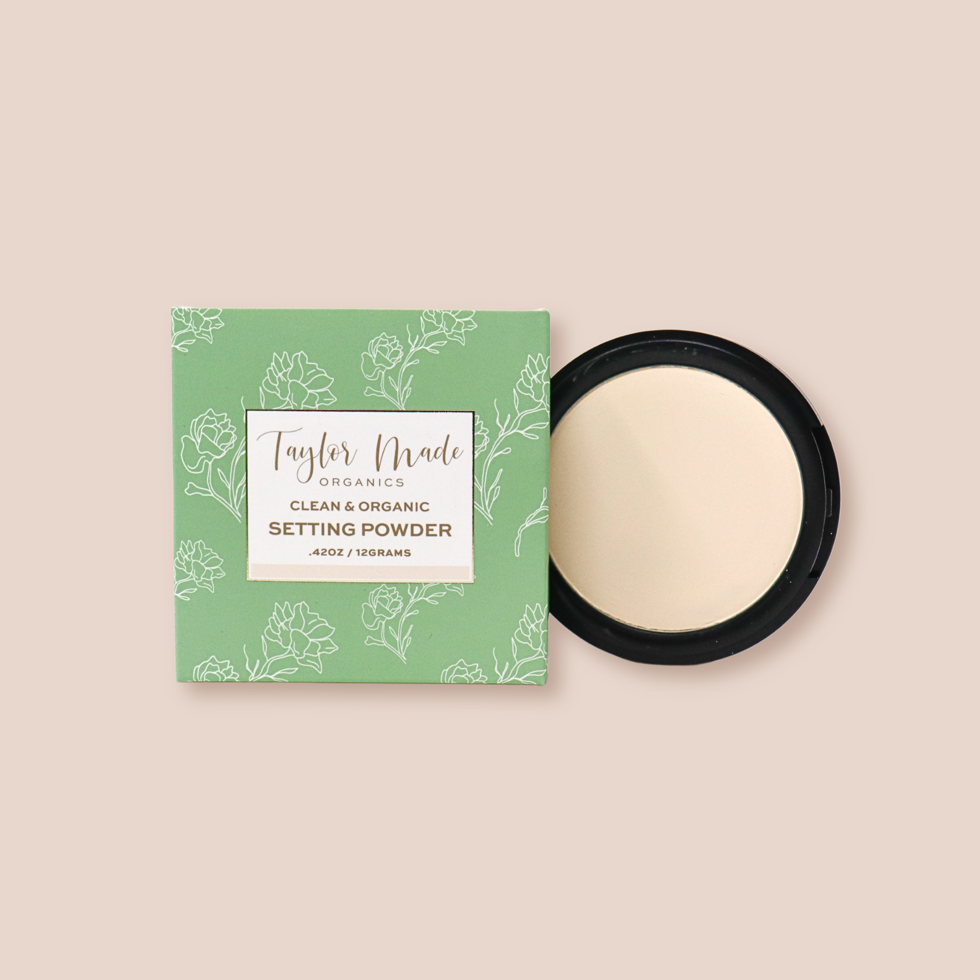 Pressed organic setting powder by Taylor Made Organics, showing a sleek compact with translucent face powder inside.