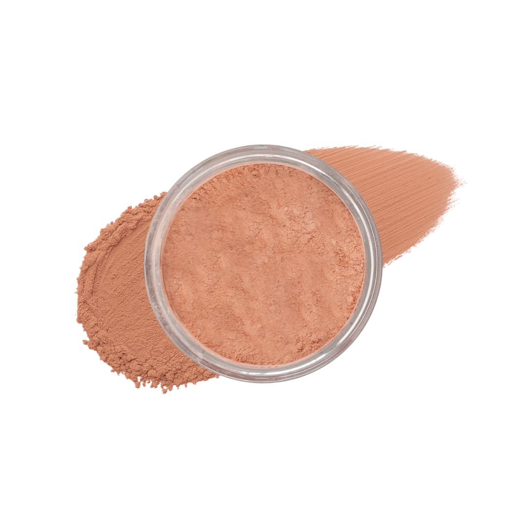 Deep loose mineral foundation by Taylor Made Organics in a jar, showing the textured powder and natural finish.