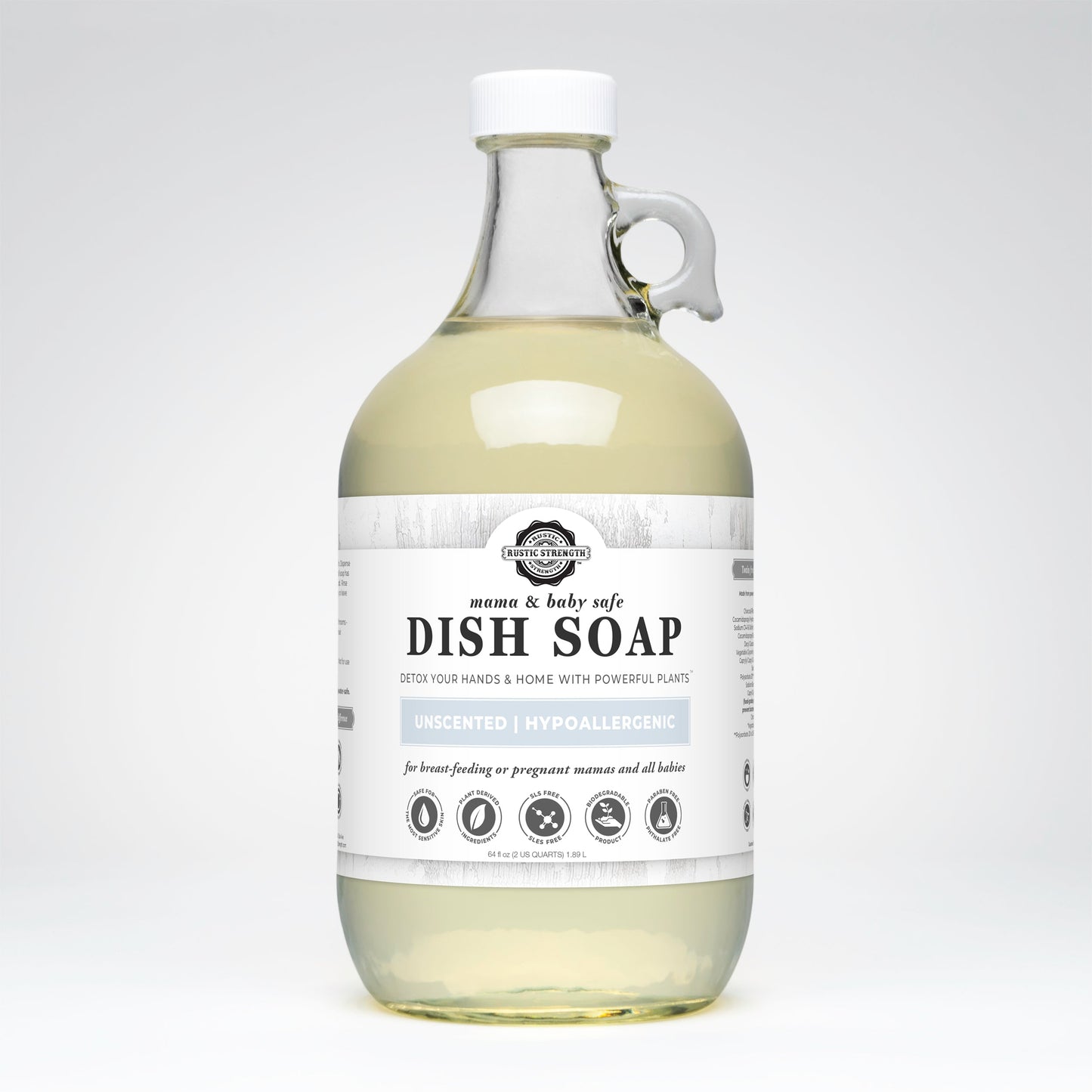Rustic Strength Dish Soap | Mama + Baby Safe comes in a clear glass bottle with a white label and black text. Its unscented, hypoallergenic, non-toxic, baby safe, and suitable for breastfeeding mothers and babies.