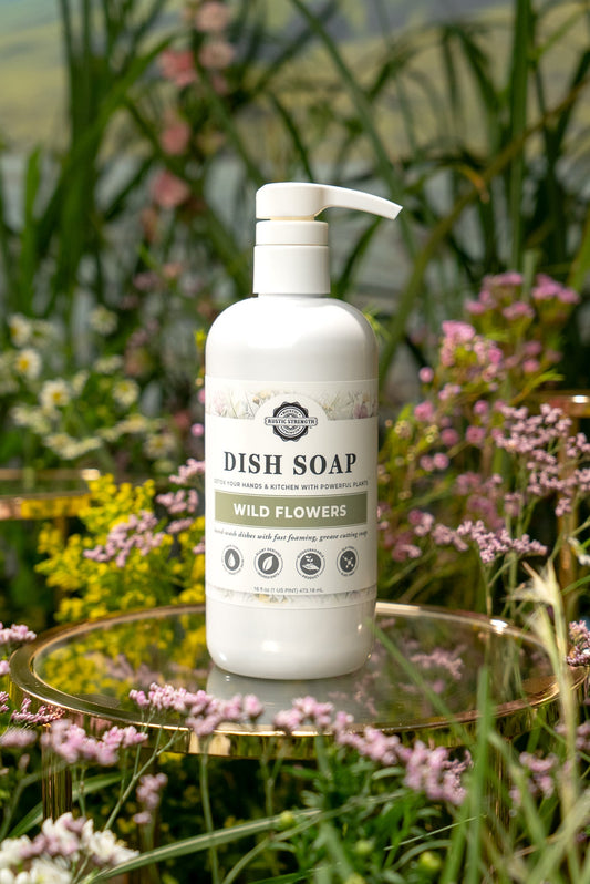 Rustic Strength wild flowers dish soap bottle with floral label, eco-friendly cleaning product for kitchen dishwashing.