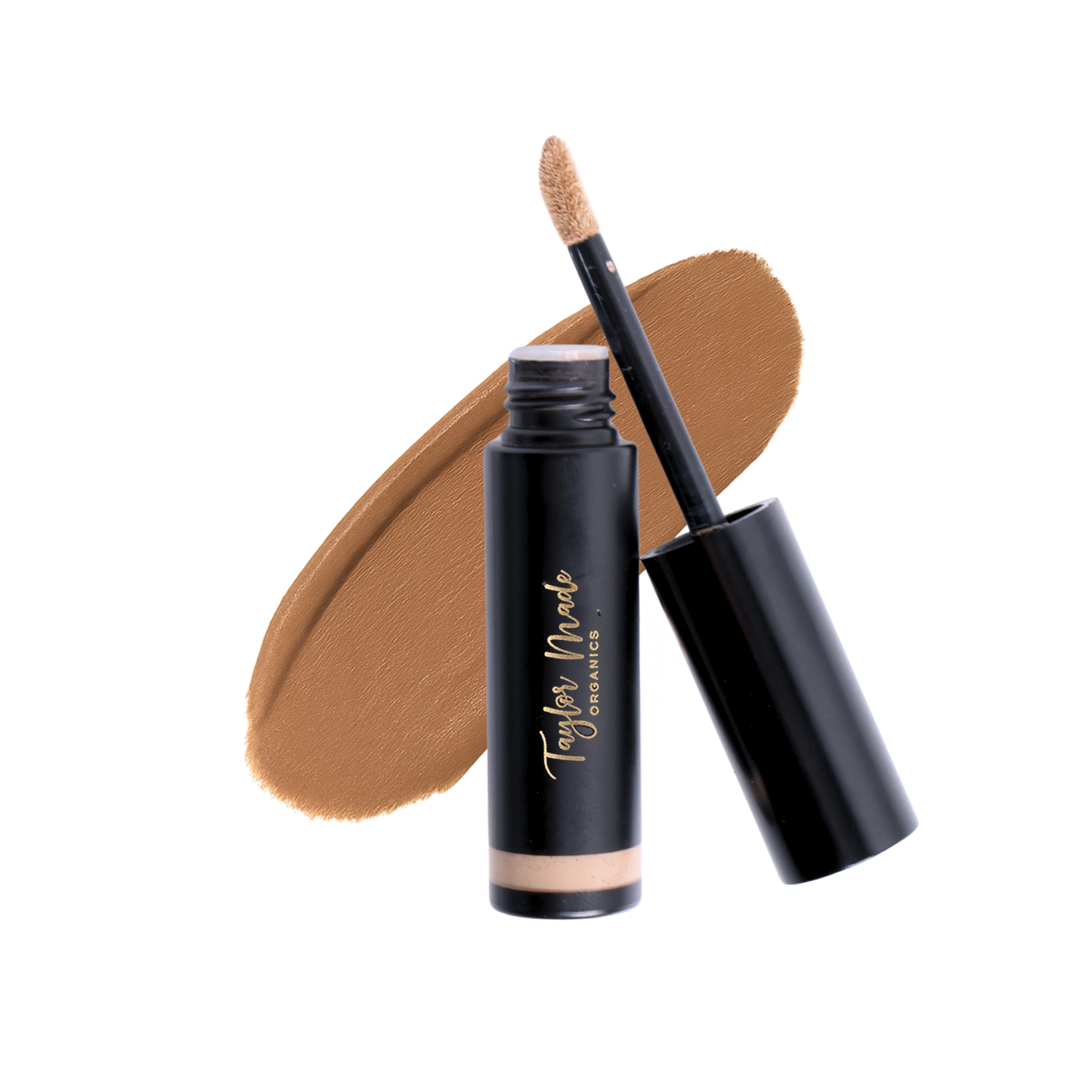 Taylor Made Organics liquid organic concealer with a smooth smear showcasing its creamy texture and natural finish.