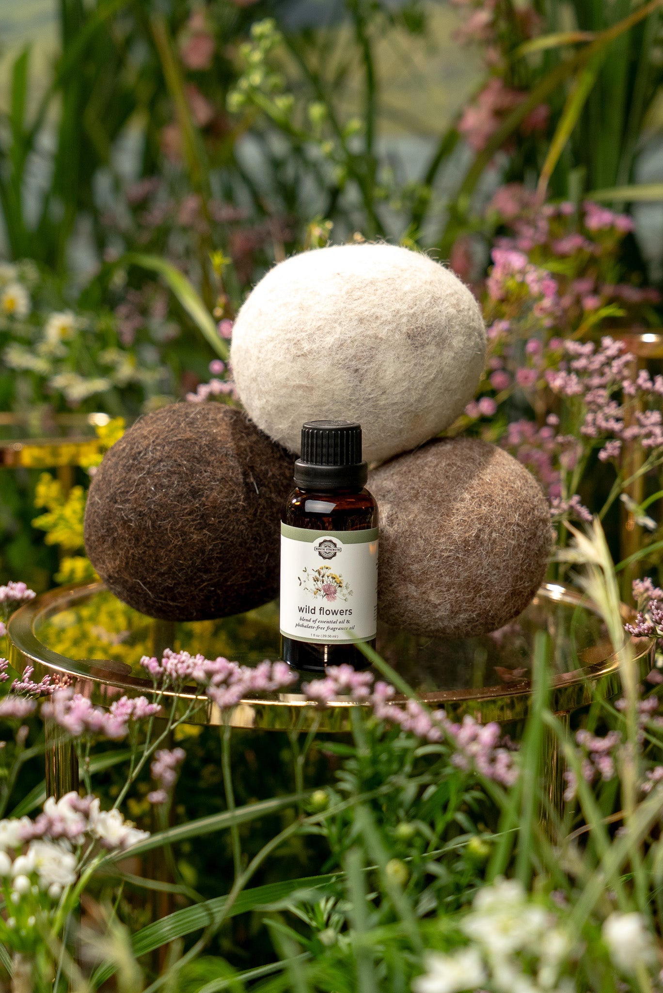 Rustic Strength Wild Flowers essential oil and fragrance oil blend in a dryer ball kit with alpaca-themed packaging.