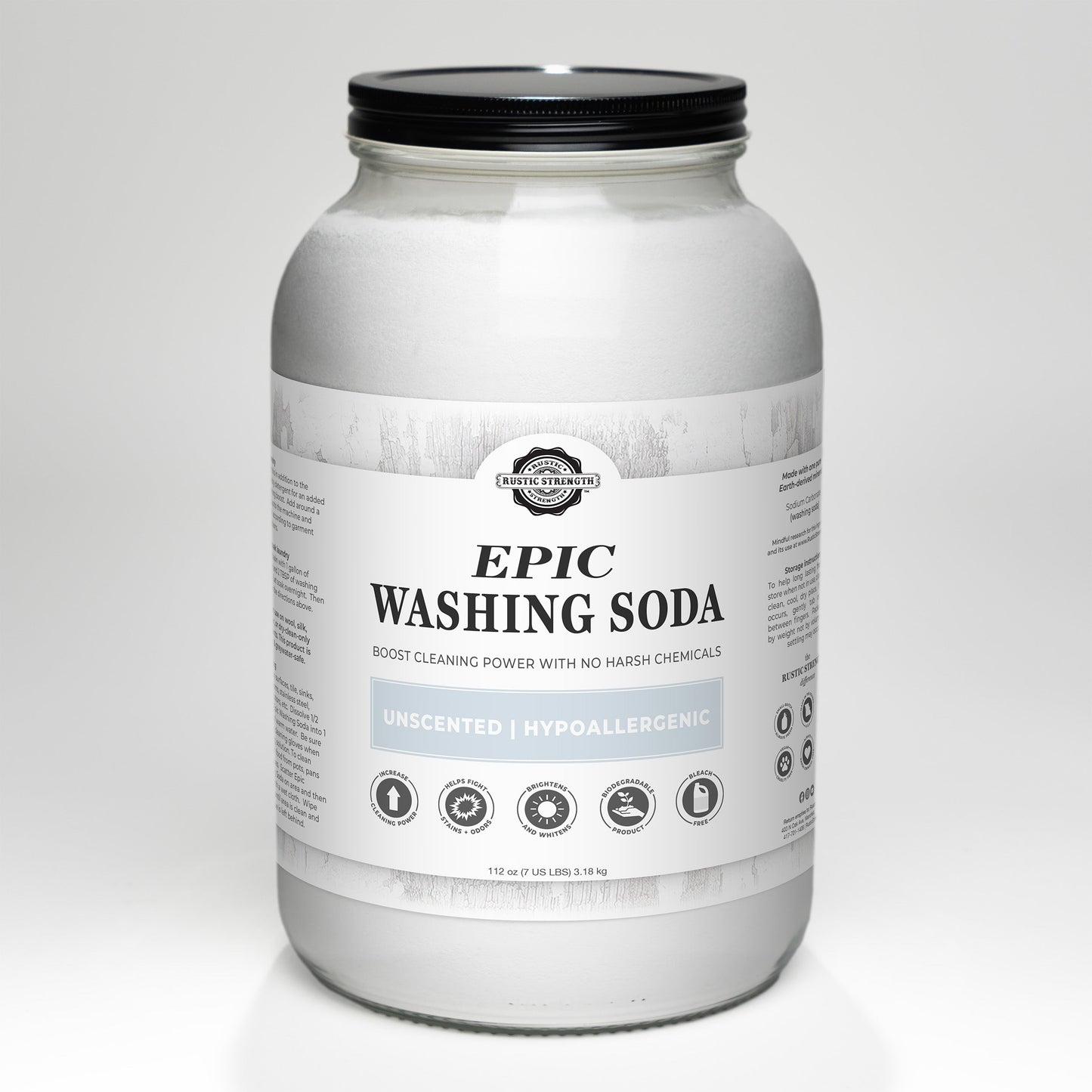 A large glass jar of Rustic Strength Epic Washing Soda with a white and gray label, marked Unscented, Biodegradable, and Hypoallergenic. This white powder boosts cleaning safely without harsh chemicals.