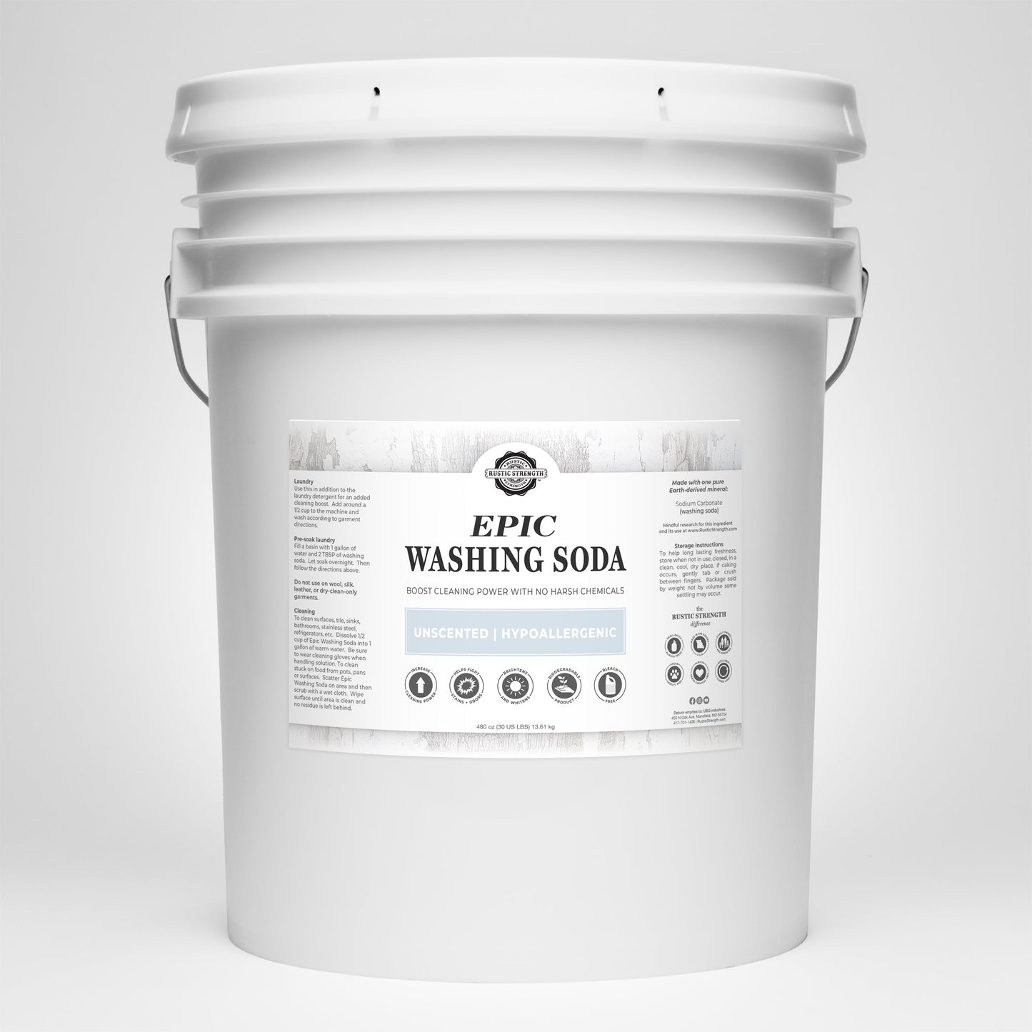 A large white plastic bucket labeled Rustic Strength Epic Washing Soda features detailed usage instructions. This unscented, hypoallergenic laundry boost also works as a biodegradable cleaner for versatile home use.
