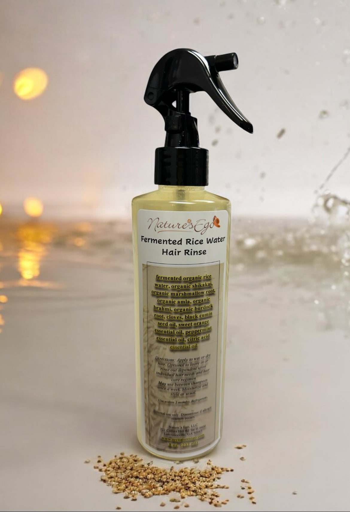 Organic fermented rice water hair rinse with black cumin seed oil by NaturesEgo, showcasing the natural herbal hair treatment in a bottle.