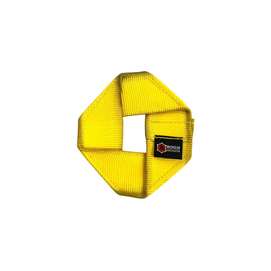 Yellow Fire Hose Dog Frisbee JR, a durable dog toy from Recycled Firefighter, designed for fetch and outdoor play.